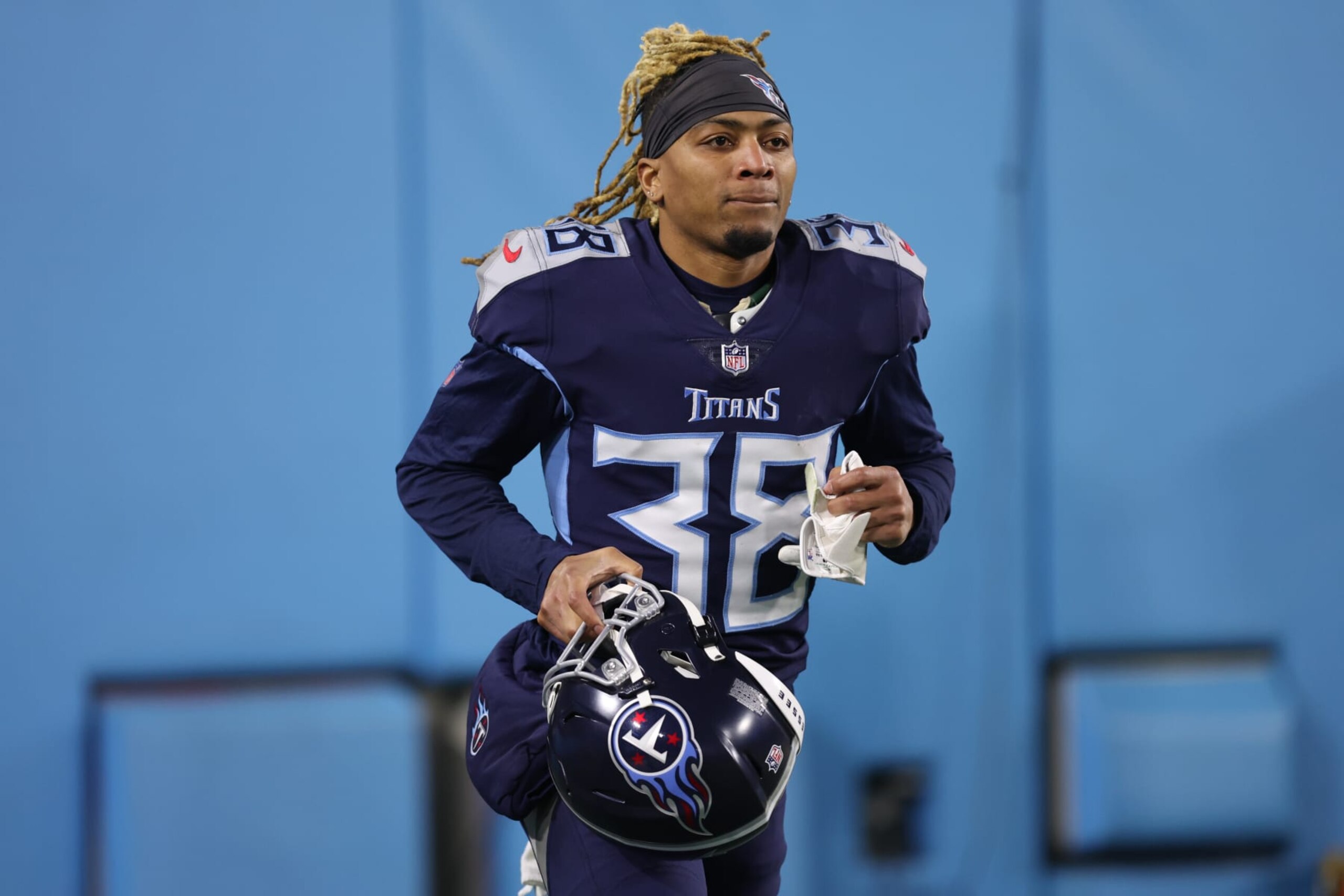 NASHVILLE, TN - JANUARY 22: Buster Skrine #38 of the Tennessee Titans runs on the sideline during the AFC Divisional Round playoff game against the Cincinnati Bengals at Nissan Stadium on January 22, 2022 in Nashville, Tennessee. (Photo by Perry Knotts/Getty Images)