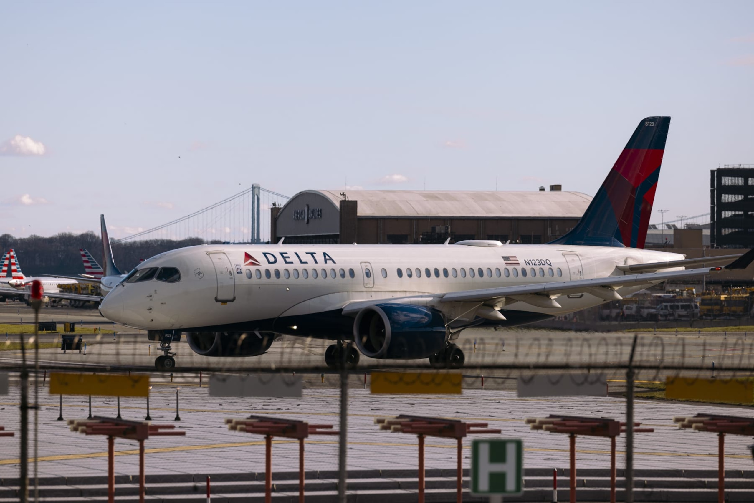 A Delta plane on the tarmac at Terminal C of LaGuardia Airport (LGA) in the Queens borough of New York, US, on Sunday, April 7, 2024. Delta Air Lines Inc. is expected to release earnings figures on April 10. Photographer: Angus Mordant/Bloomberg via Getty Images