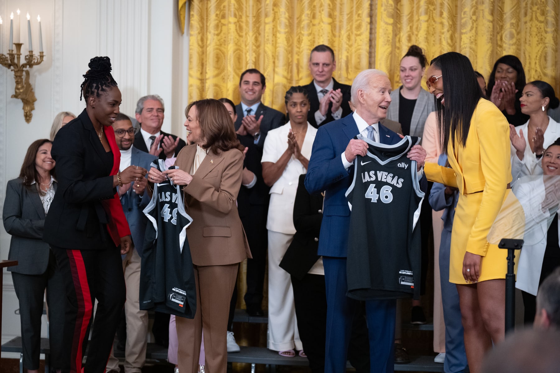 WASHINGTON, DC - MAY 9: Las Vegas Aces forward A'ja Wilson (R) and Las Vegas Aces guard Chelsea Gray (L) present jerseys to U.S. Vice President Kamala Harris and U.S. President Joe Biden during a ceremony to celebrate the WNBA Champion Las Vegas Aces in the East Room of the White House on May 9, 2024 in Washington, DC. The Las Vegas Aces defeated the New York Liberty 70-69 in Game 4 of the 2023 WNBA Finals on October 18, 2023 at Barclays Center in Brooklyn, New York. (Photo by Andrew Harnik/Getty Images)