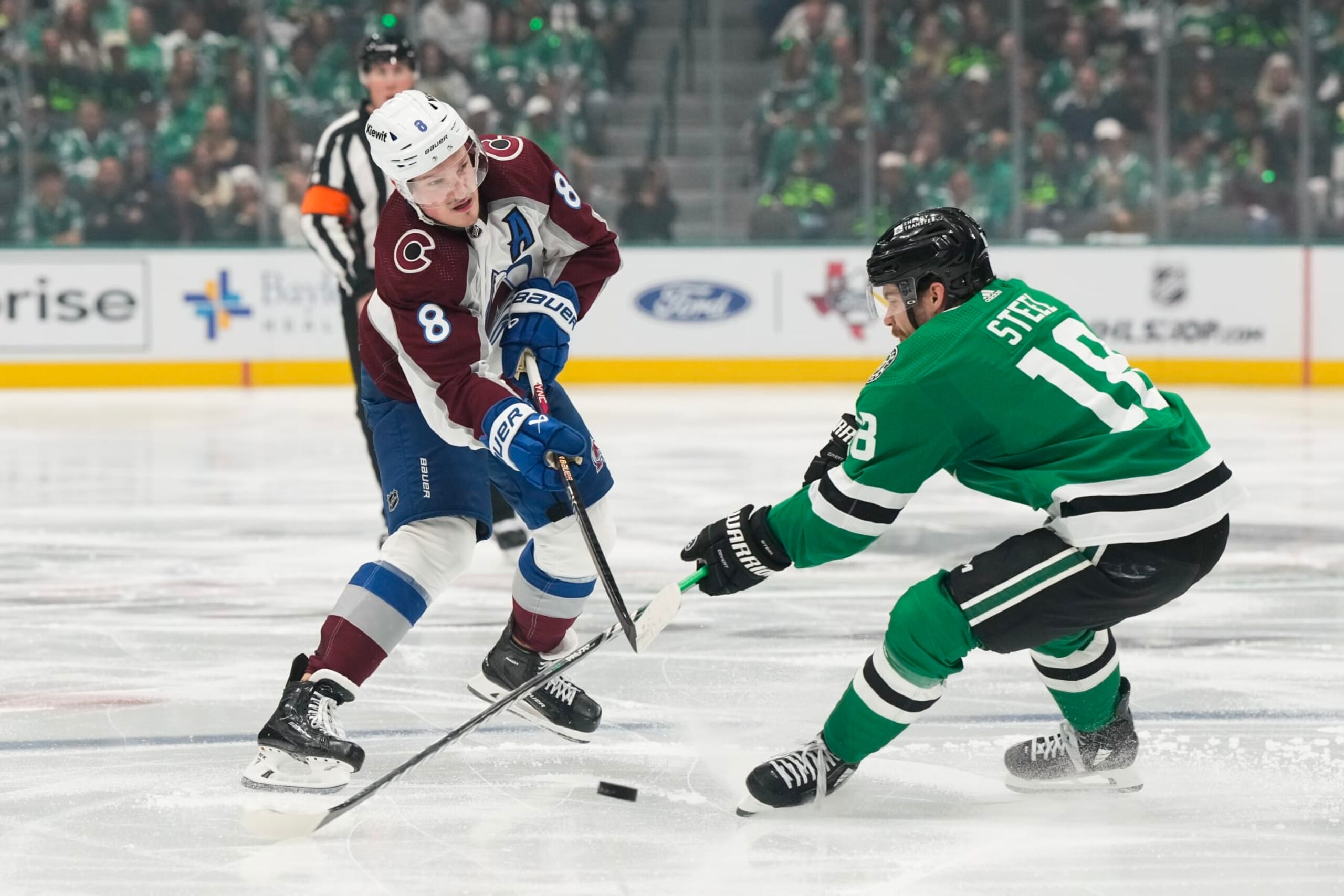 DALLAS, TEXAS - MAY 09: Cale Makar #8 of the Colorado Avalanche shoots the puck against Sam Steel #18 of the Dallas Stars during the second period in Game Two of the Second Round of the 2024 Stanley Cup Playoffs at American Airlines Center on May 09, 2024 in Dallas, Texas.  (Photo by Sam Hodde/Getty Images)