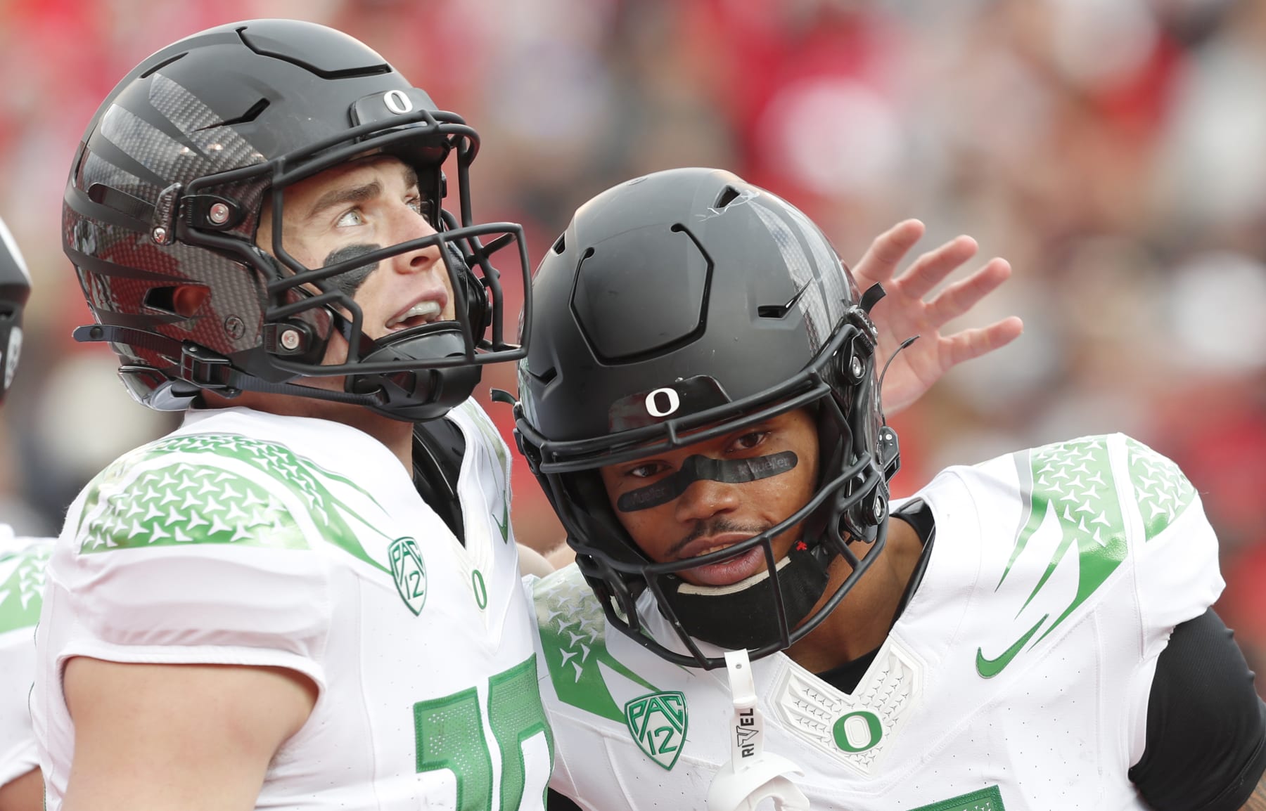 SALT LAKE CITY, UT - OCTOBER 28:  Bo Nix #10 of the Oregon Ducks congratulates Troy Franklin #11 after he caught a touchdown pass during the first half of their game against the Utah Utes at Rice Eccles Stadium on October 28, 2023 in Salt Lake City, Utah.  (Photo by Chris Gardner/Getty Images)