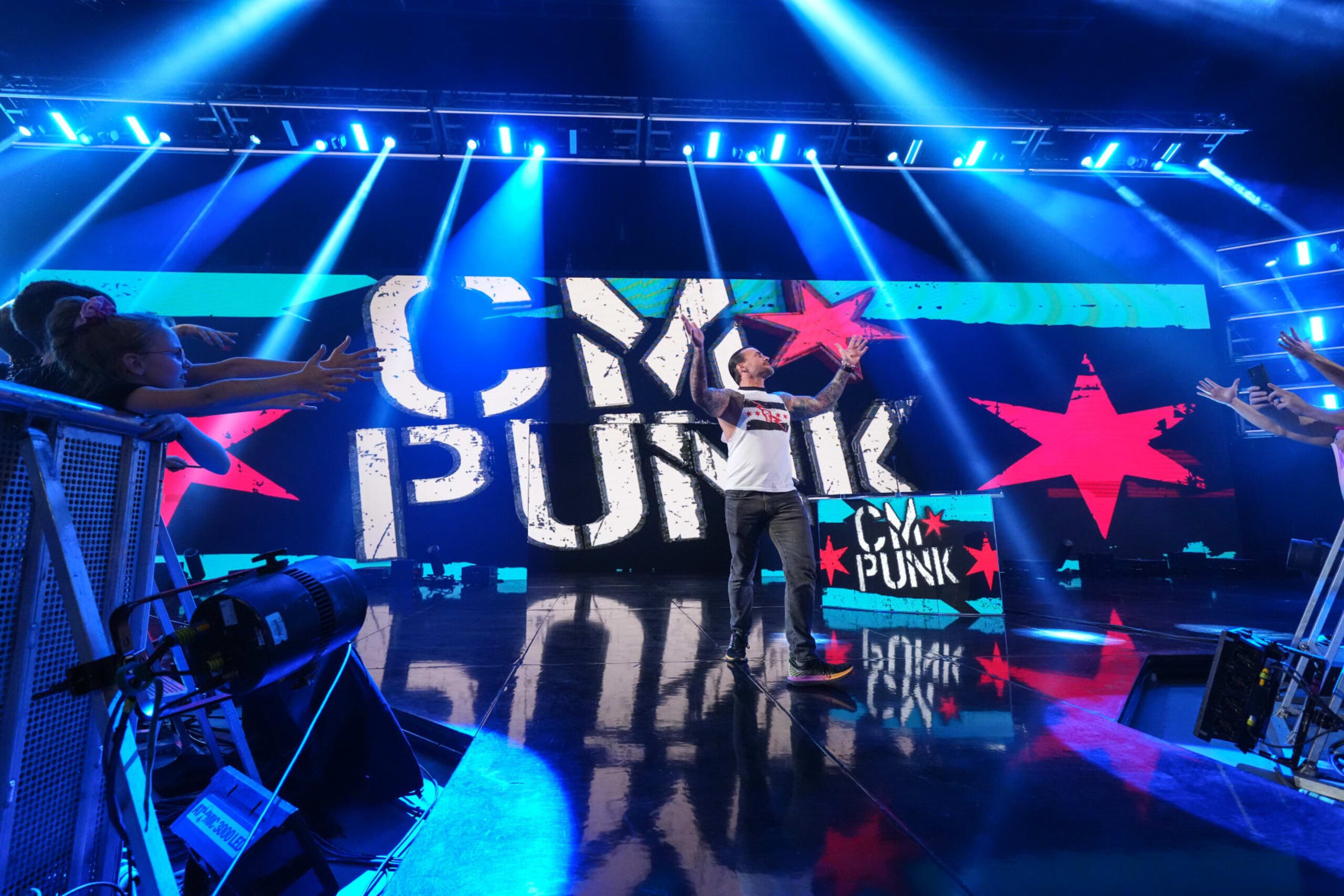 KANSAS CITY, MISSOURI - APRIL 29: CM Punk makes his way to the ring at T-Mobile Center on April 29, 2024 in Kansas City, Missouri.  (Photo by WWE/Getty Images)