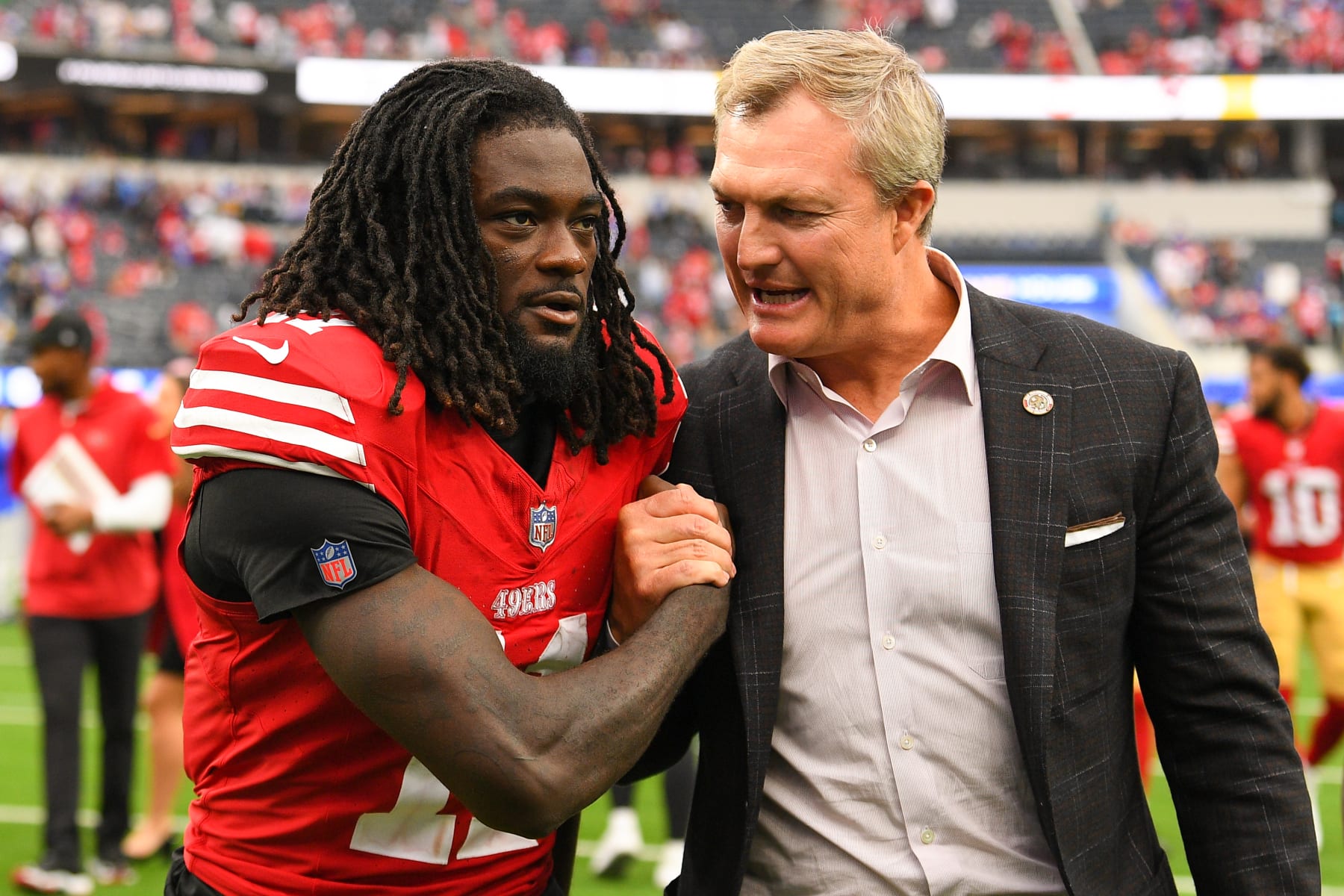 INGLEWOOD, CA - SEPTEMBER 17: San Francisco 49ers wide receiver Brandon Aiyuk (11) celebrates with general manager John Lynch after the NFL game between the San Francisco 49ers and the Los Angeles Rams on September 17, 2023, at SoFi Stadium in Inglewood, CA. (Photo by Brian Rothmuller/Icon Sportswire via Getty Images)