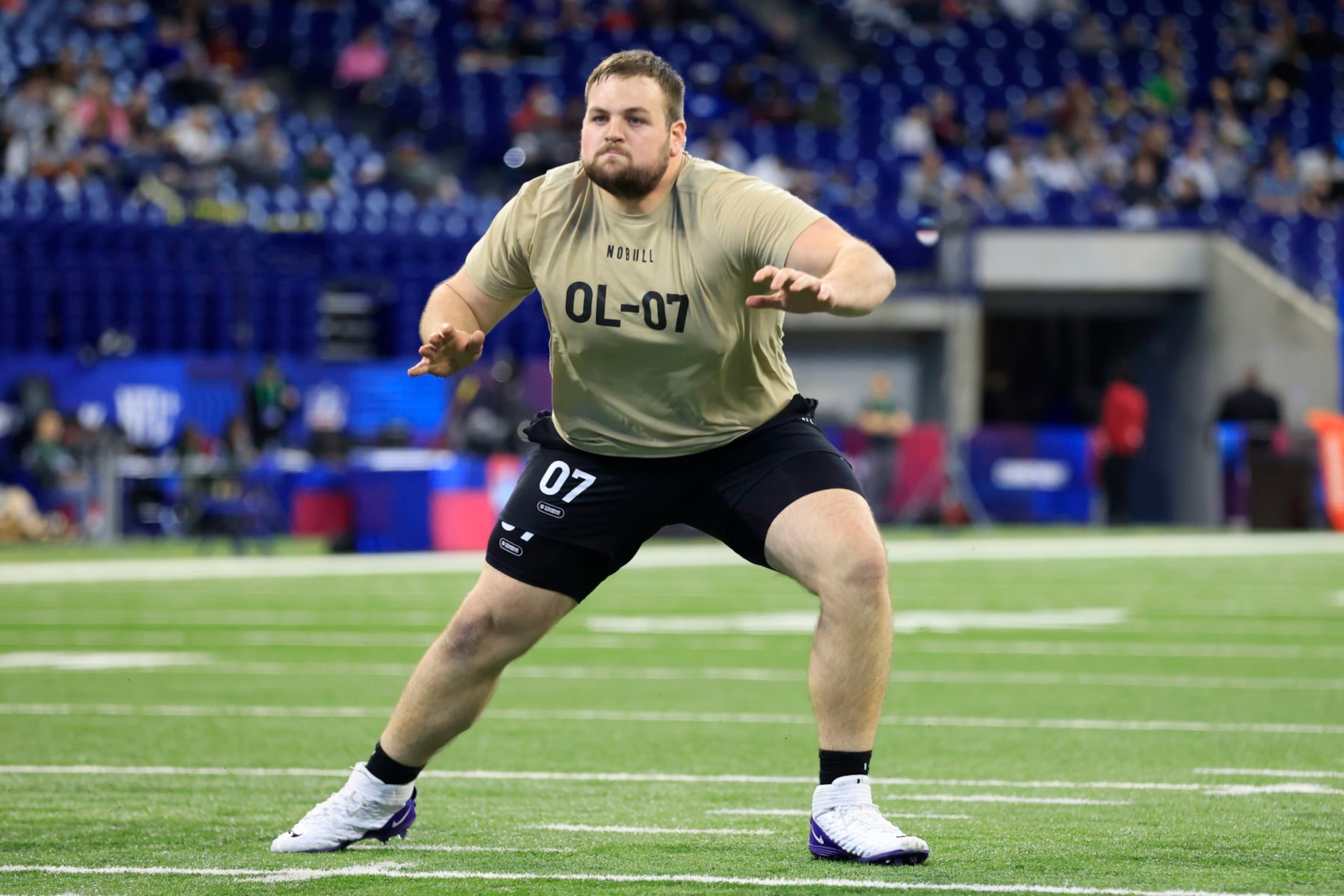 INDIANAPOLIS, INDIANA - MARCH 03: Cooper Beebe #OL07 of the Kansas State  participates in a drill during the NFL Combine at Lucas Oil Stadium on March 03, 2024 in Indianapolis, Indiana. (Photo by Justin Casterline/Getty Images)