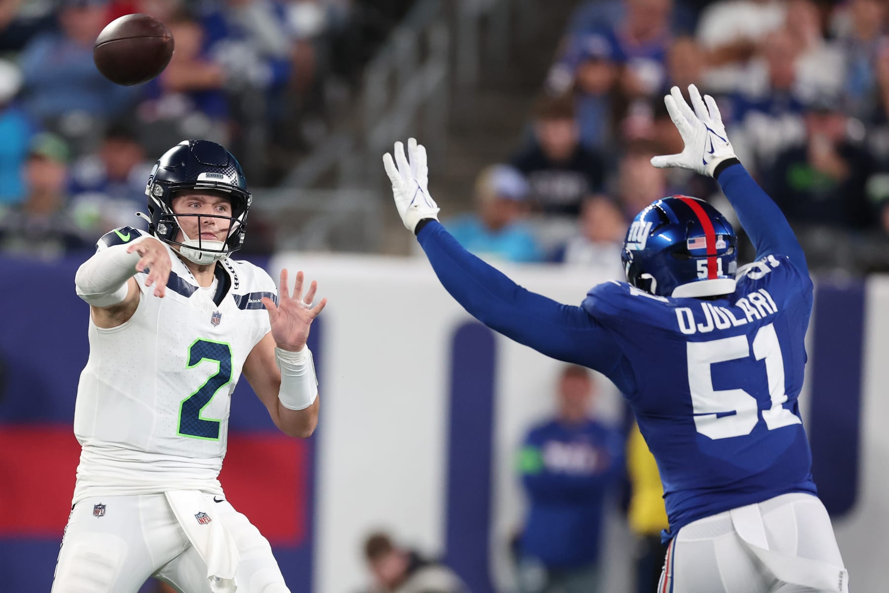 EAST RUTHERFORD, NEW JERSEY - OCTOBER 02: Drew Lock #2 of the Seattle Seahawks throws the ball against Azeez Ojulari #51 of the New York Giants during the second quarter at MetLife Stadium on October 02, 2023 in East Rutherford, New Jersey. (Photo by Al Bello/Getty Images)