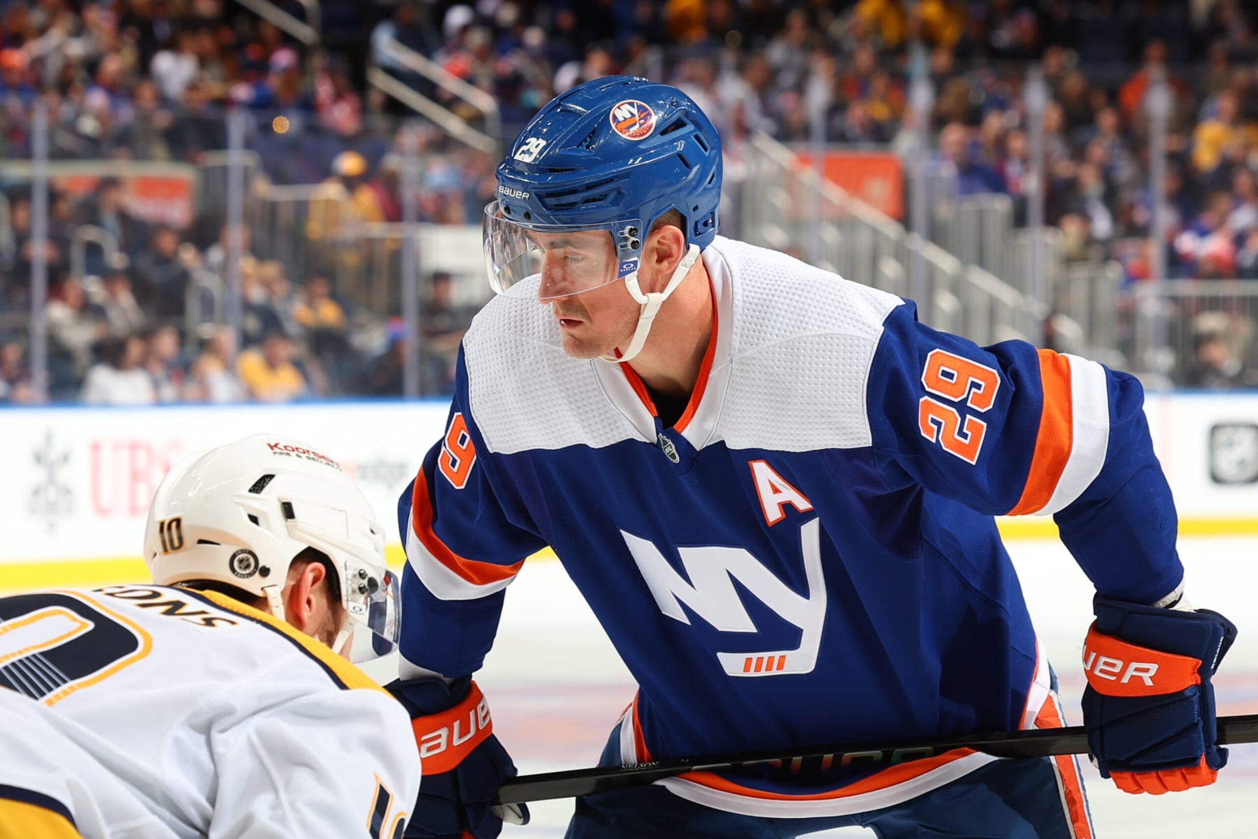 ELMONT, NY - APRIL 06: Brock Nelson #29 of the New York Islanders gets ready to take a faceoff in the third period of the game against the Nashville Predators at UBS Arena on April 6, 2024 in Elmont, New York.  (Photo by Rich Graessle/NHLI via Getty Images)