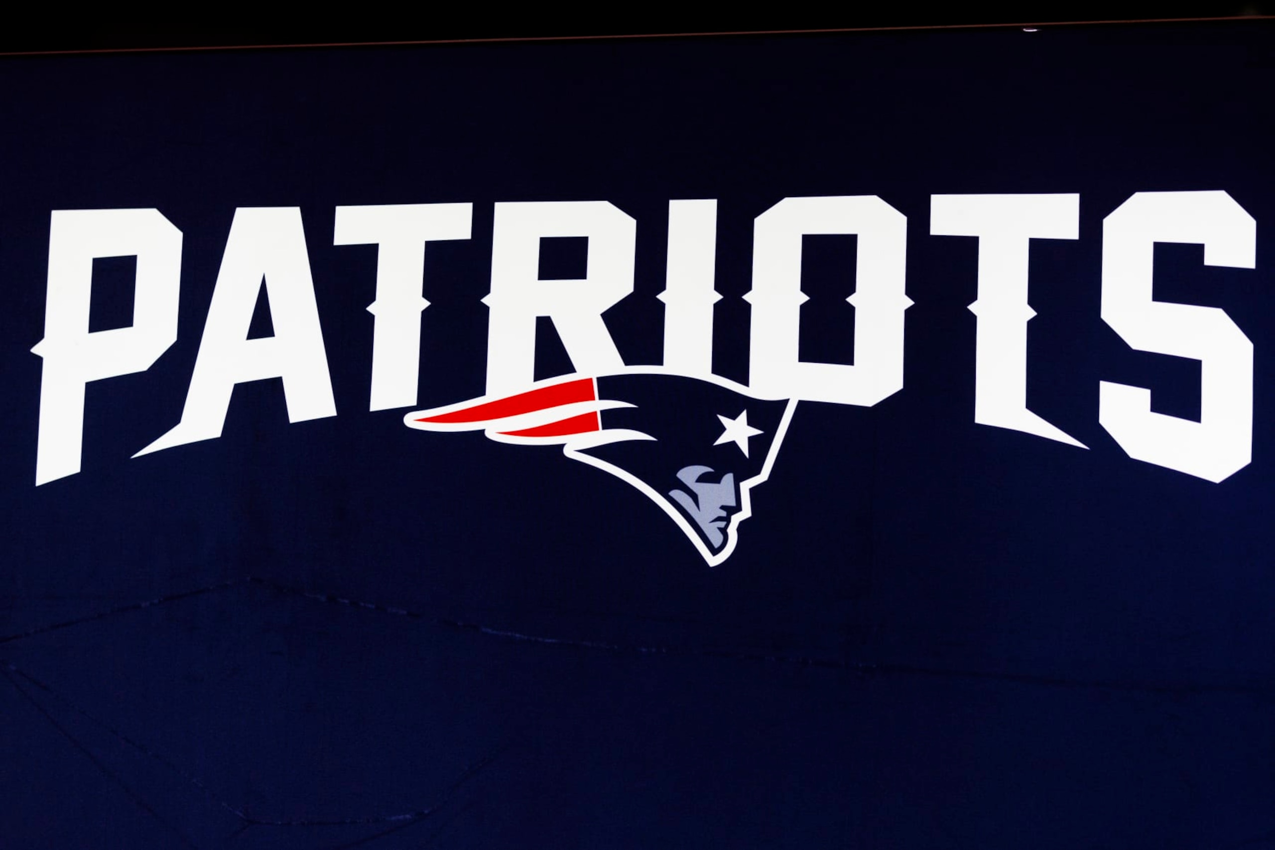 LOS ANGELES, CA - FEBRUARY 08: Detail view of the New England Patriots logo seen at the Super Bowl Experience on February 08, 2022, at the Los Angeles Convention Center in Los Angeles, CA. (Photo by Ric Tapia/Icon Sportswire via Getty Images) LOS ANGELES, CA - FEBRUARY 08: Detail view of the New England Patriots logo seen at the Super Bowl Experience on February 08, 2022, at the Los Angeles Convention Center in Los Angeles, CA. (Photo by Ric Tapia/Icon Sportswire via Getty Images)