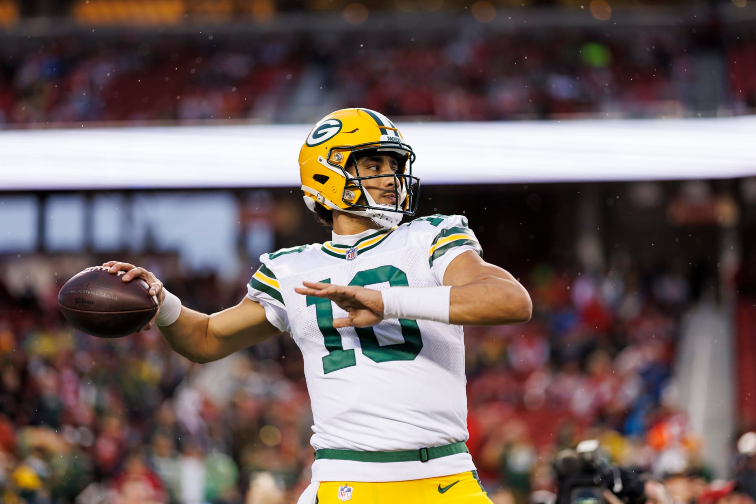 SANTA CLARA, CALIFORNIA - JANUARY 20: Jordan Love #10 of the Green Bay Packers looks to throw a pass during pregame warmups before an NFC divisional round playoff football game against the San Francisco 49ers at Levi's Stadium on January 20, 2024 in Santa Clara, California. (Photo by Ryan Kang/Getty Images)
