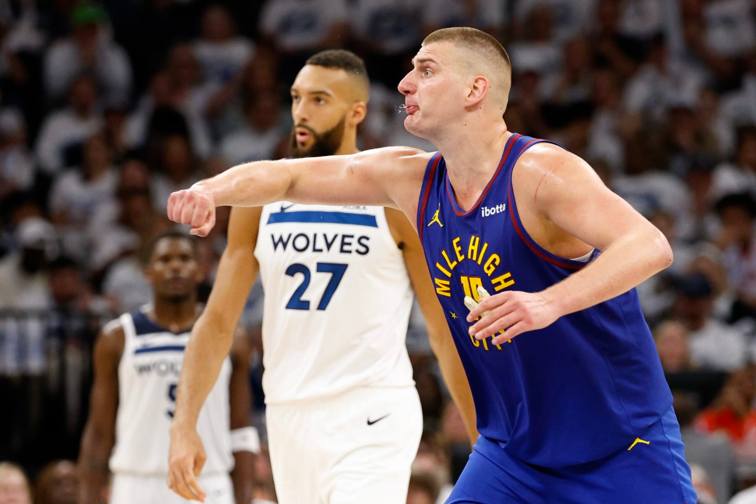 MINNEAPOLIS, MINNESOTA - MAY 10: Nikola Jokic #15 of the Denver Nuggets reacts in front of Rudy Gobert #27 of the Minnesota Timberwolves during the third quarter in Game Three of the Western Conference Second Round Playoffs at Target Center on May 10, 2024 in Minneapolis, Minnesota. NOTE TO USER: User expressly acknowledges and agrees that, by downloading and or using this photograph, User is consenting to the terms and conditions of the Getty Images License Agreement. (Photo by David Berding/Getty Images)