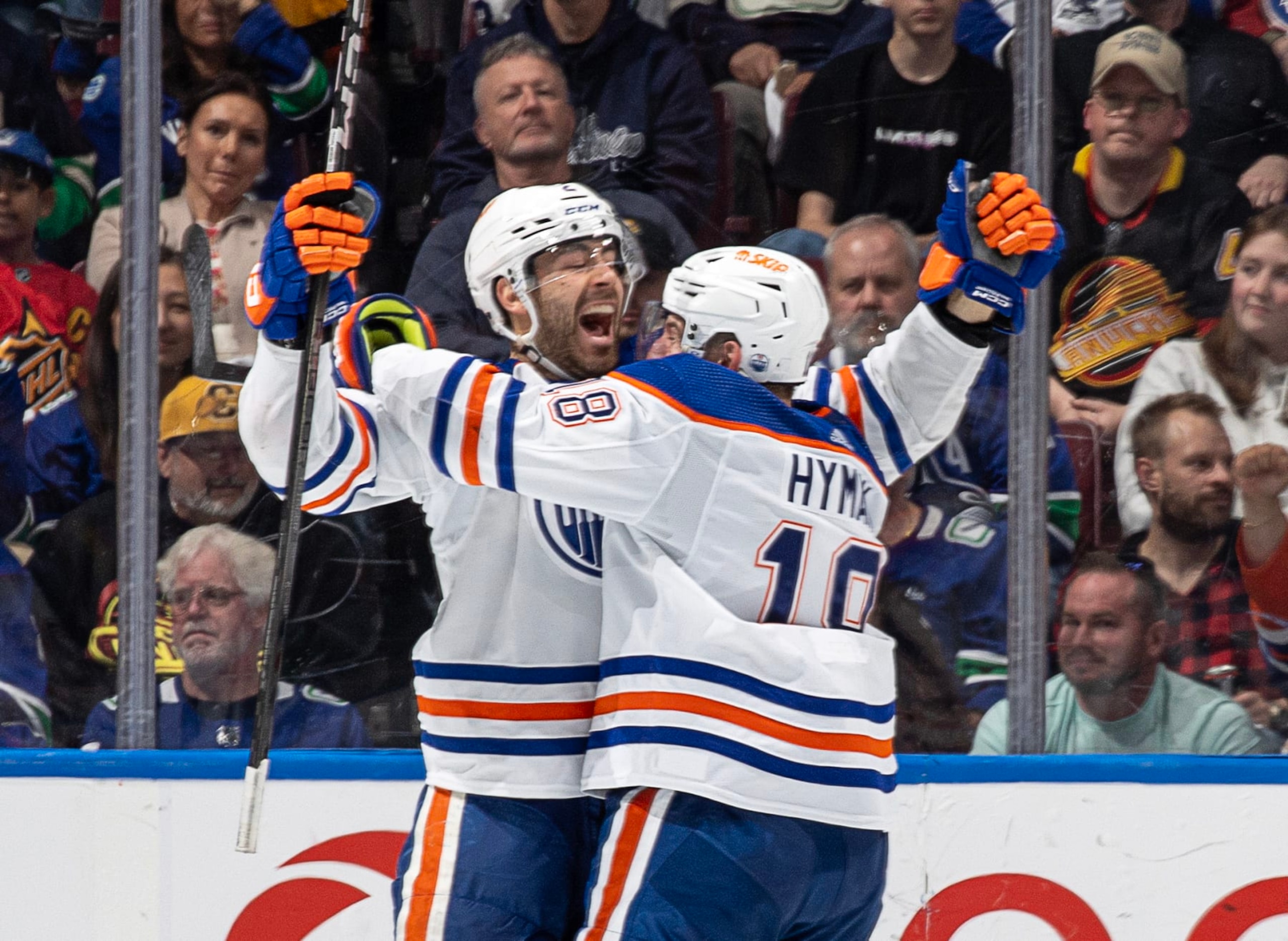 VANCOUVER, CANADA - MAY 10: Evan Bouchard #2 of the Edmonton Oilers celebrates his game winning goal during overtime in Game Two of the Second Round of the 2024 Stanley Cup Playoffs against the Vancouver Canucks at Rogers Arena on May 10, 2024 in Vancouver, British Columbia, Canada. (Photo by Jeff Vinnick/NHLI via Getty Images) VANCOUVER, CANADA - MAY 10: Evan Bouchard #2 of the Edmonton Oilers celebrates his game winning goal during overtime in Game Two of the Second Round of the 2024 Stanley Cup Playoffs against the Vancouver Canucks at Rogers Arena on May 10, 2024 in Vancouver, British Columbia, Canada. (Photo by Jeff Vinnick/NHLI via Getty Images)