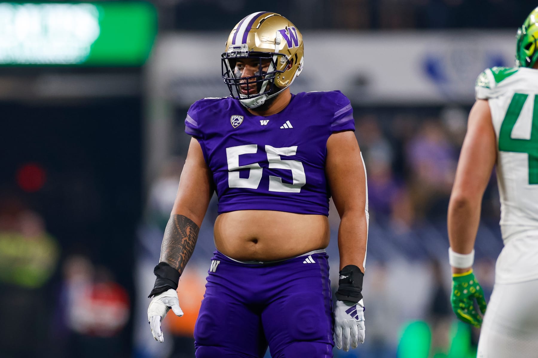 LAS VEGAS, NEVADA - DECEMBER 1: Troy Fautanu #55 of the Washington Huskies in an offensive position during the Pac-12 Championship game against the Oregon Ducks at Allegiant Stadium on December 1, 2023 in Las Vegas, Nevada. (Photo by Brandon Sloter/Image Of Sport/Getty Images)