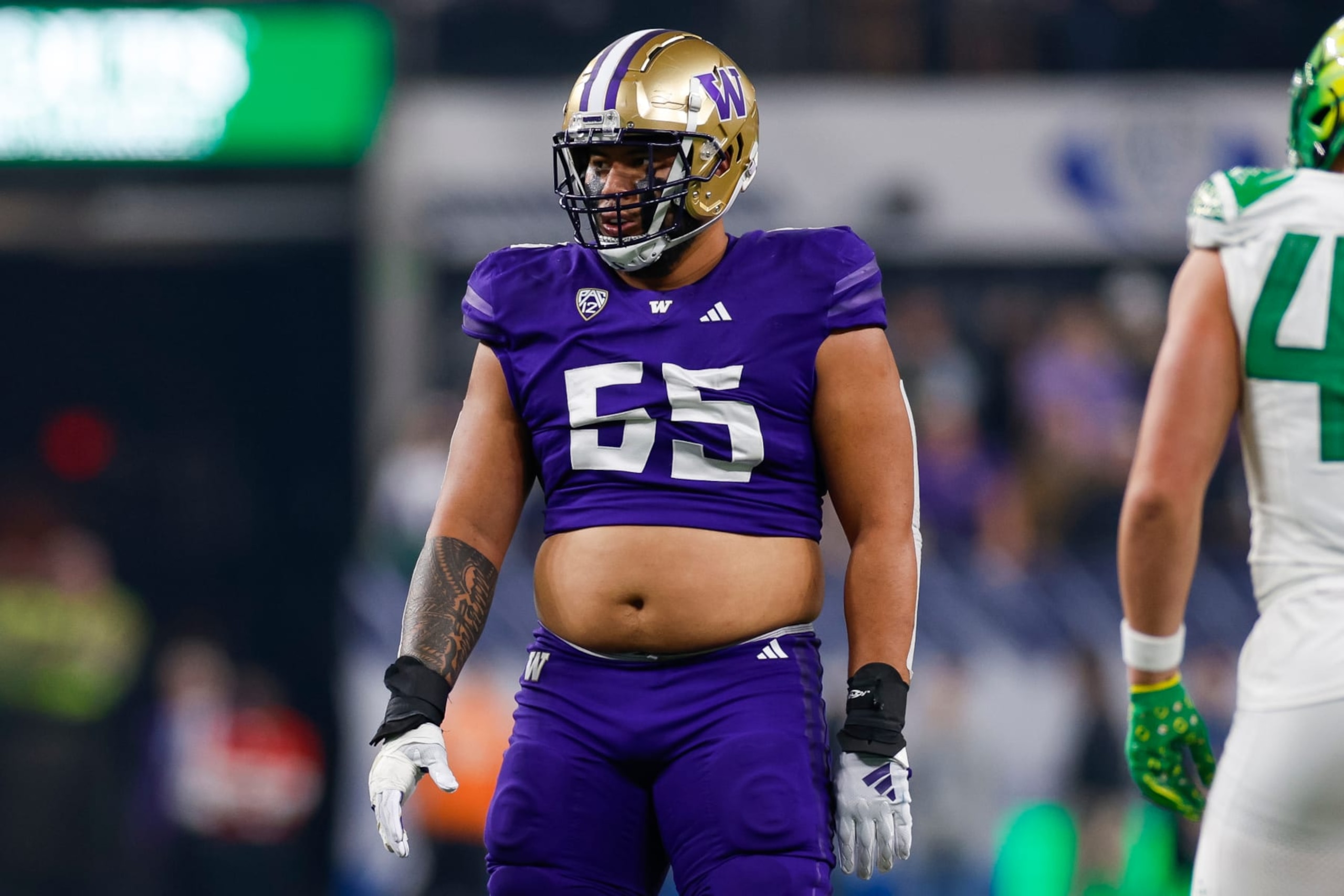 LAS VEGAS, NEVADA - DECEMBER 1: Troy Fautanu #55 of the Washington Huskies in an offensive position during the Pac-12 Championship game against the Oregon Ducks at Allegiant Stadium on December 1, 2023 in Las Vegas, Nevada. (Photo by Brandon Sloter/Image Of Sport/Getty Images)