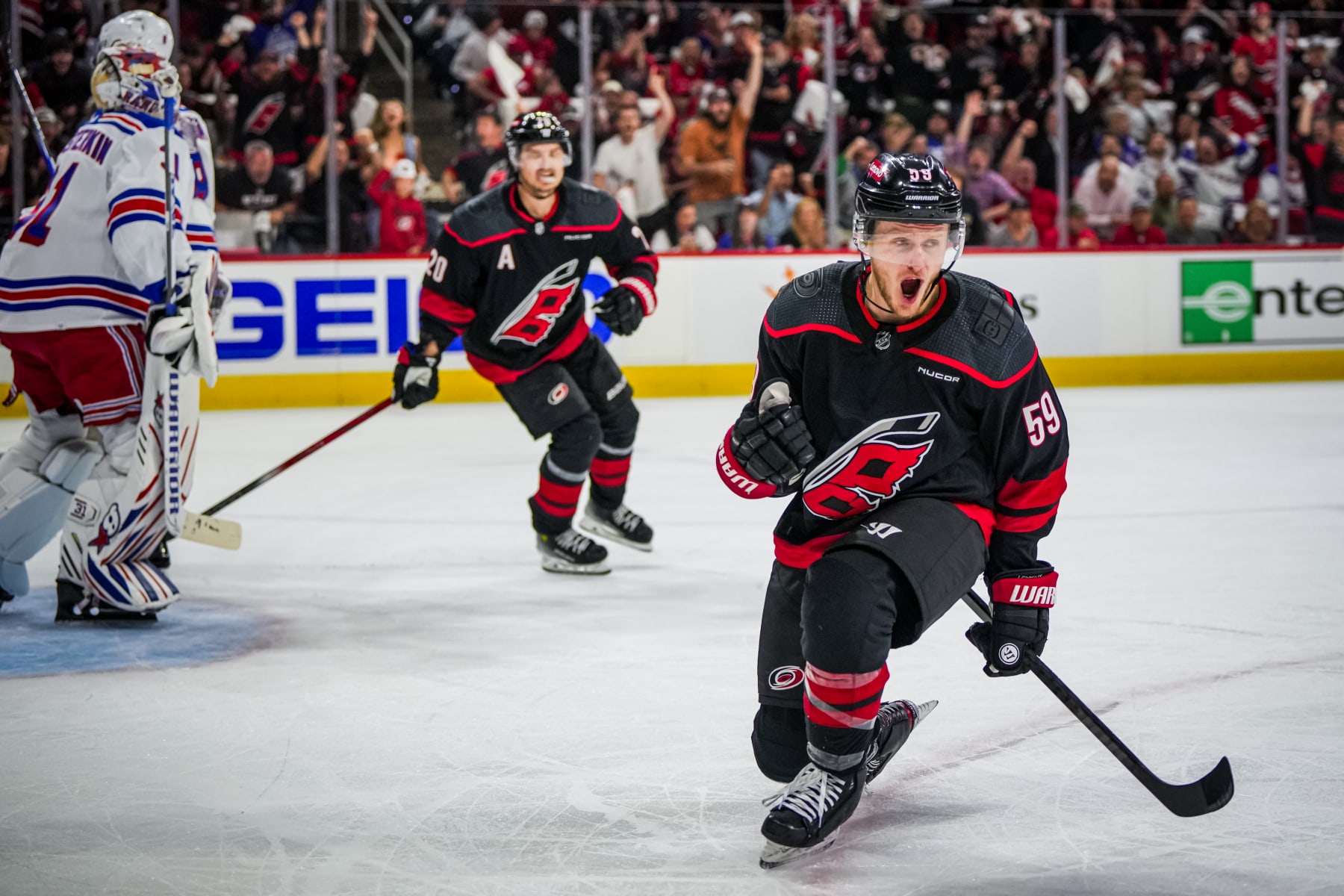 RALEIGH, NORTH CAROLINA - MAY 09: Jake Guentzel #59 of the Carolina Hurricanes celebrates his goal against the New York Rangers during the first period in Game Three of the Second Round of the 2024 Stanley Cup Playoffs at PNC Arena on May 09, 2024 in Raleigh, North Carolina.  (Photo by Josh Lavallee/NHLI via Getty Images)