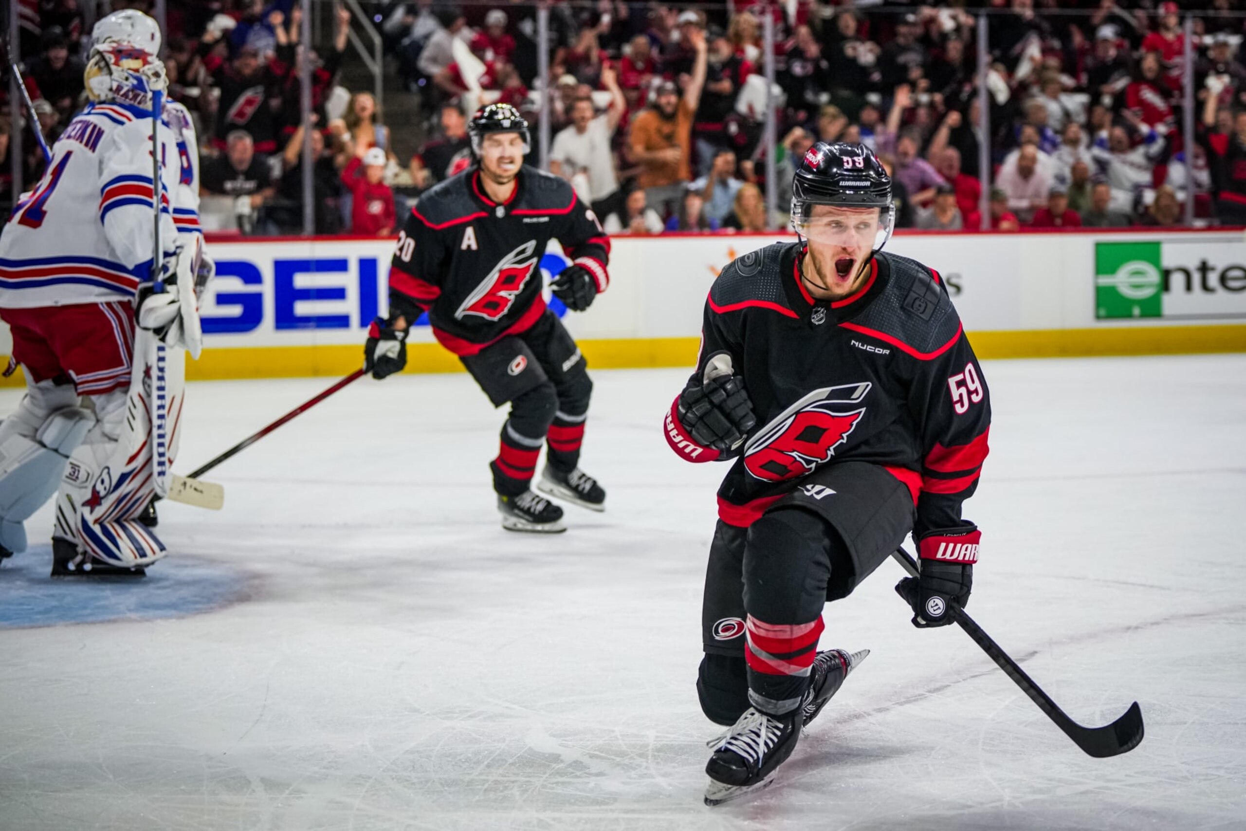 RALEIGH, NORTH CAROLINA - MAY 09: Jake Guentzel #59 of the Carolina Hurricanes celebrates his goal against the New York Rangers during the first period in Game Three of the Second Round of the 2024 Stanley Cup Playoffs at PNC Arena on May 09, 2024 in Raleigh, North Carolina.  (Photo by Josh Lavallee/NHLI via Getty Images)