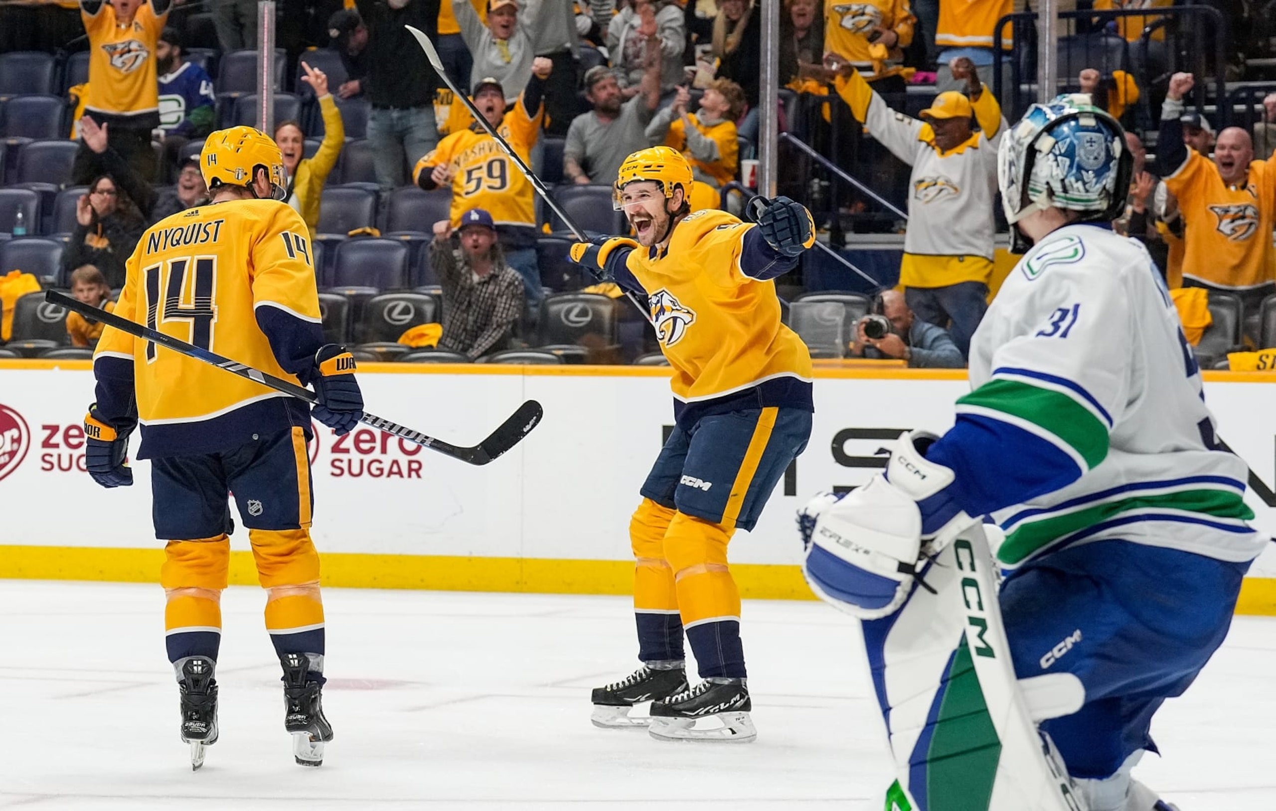 NASHVILLE, TENNESSEE - APRIL 28: Gustav Nyquist #14 celebrates his goal with Filip Forsberg #9 of the Nashville Predators against the Vancouver Canucks in Game Four of the First Round of the 2024 Stanley Cup Playoffs at Bridgestone Arena on April 28, 2024 in Nashville, Tennessee. (Photo by John Russell/NHLI via Getty Images)