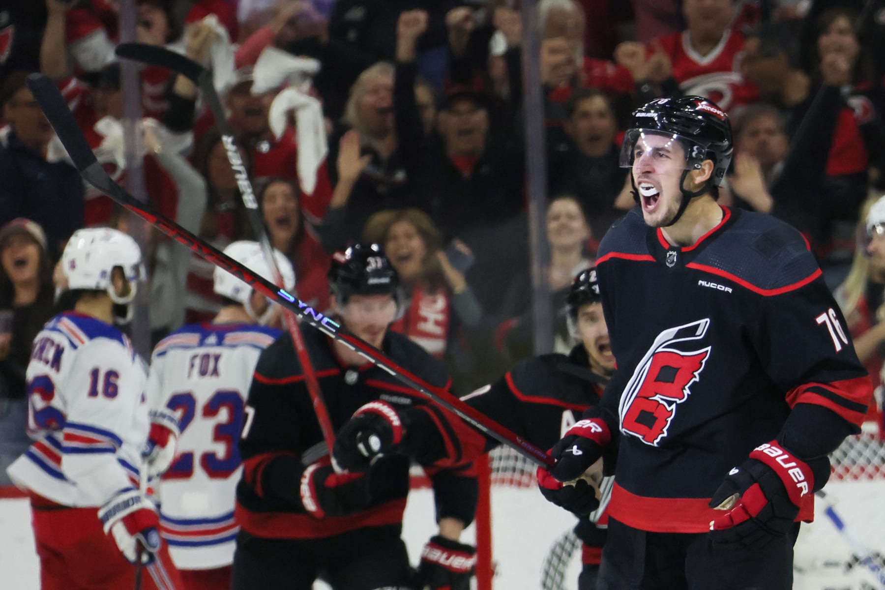 RALEIGH, NORTH CAROLINA - MAY 11: Brady Skjei #76 of the Carolina Hurricanes celebrates after scoring a goal against the New York Rangers during the third period in Game Four of the Second Round of the 2024 Stanley Cup Playoffs at PNC Arena on May 11, 2024 in Raleigh, North Carolina. (Photo by Bruce Bennett/Getty Images)