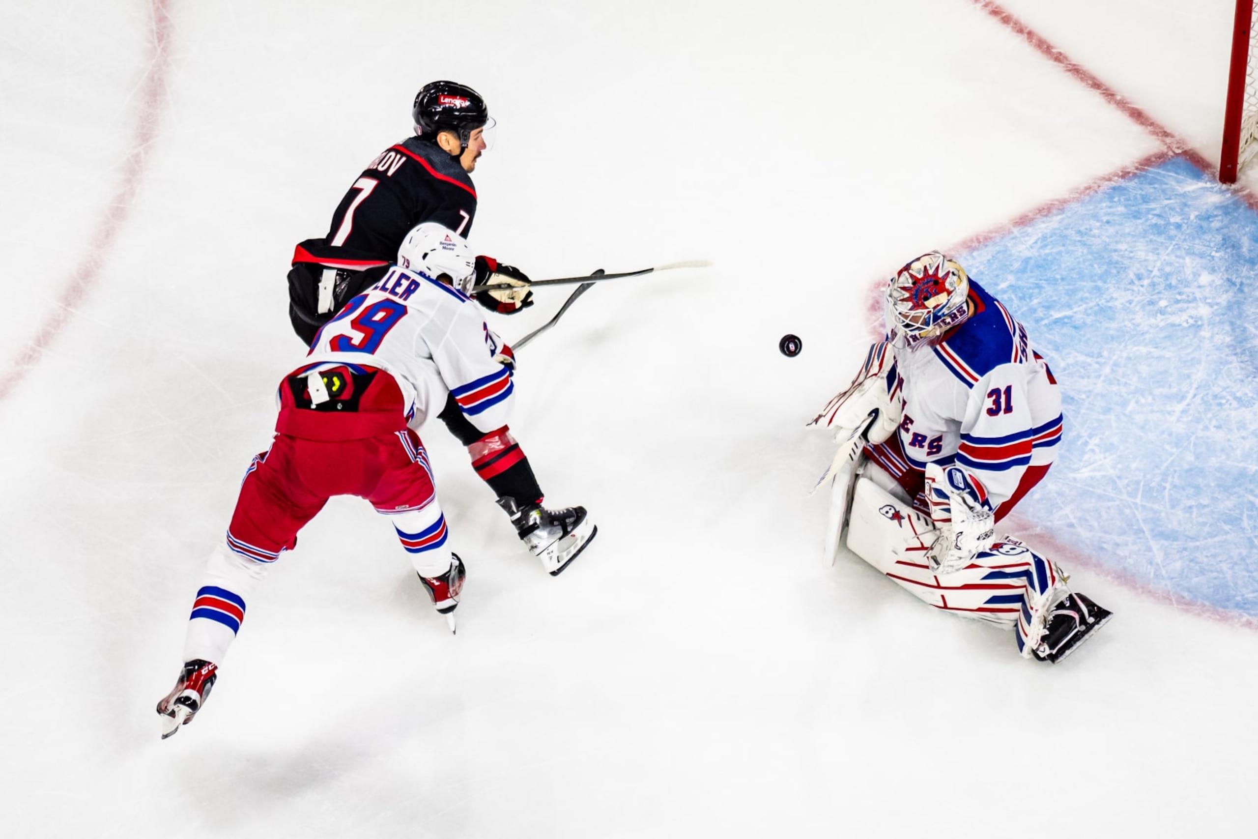 RALEIGH, NORTH CAROLINA - MAY 09: Dmitry Orlov #7 of the Carolina Hurricanes shoots against Igor Shesterkin #31 of the New York Rangers during the first period in Game Three of the Second Round of the 2024 Stanley Cup Playoffs at PNC Arena on May 09, 2024 in Raleigh, North Carolina.  (Photo by Josh Lavallee/NHLI via Getty Images)