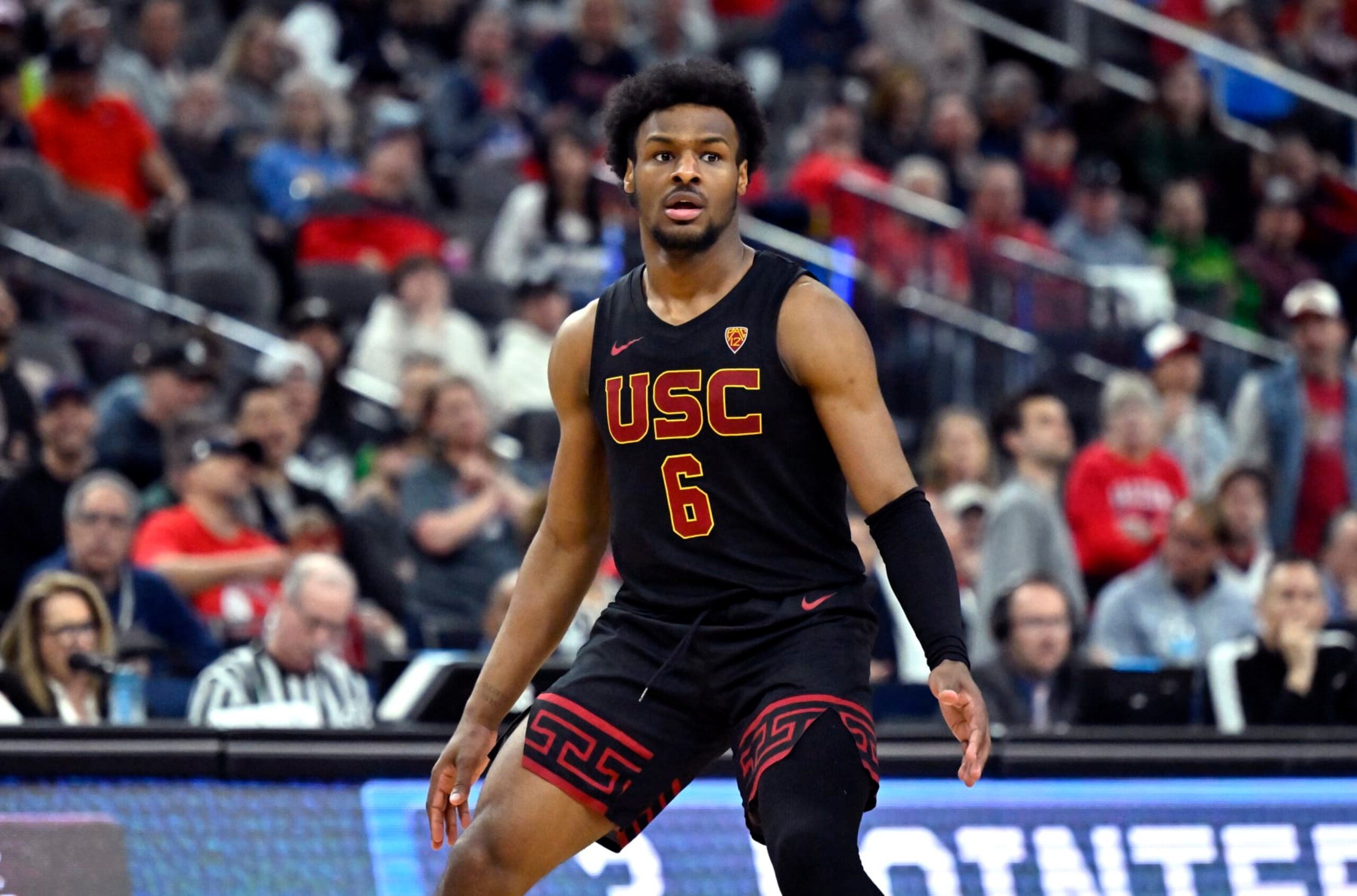 LAS VEGAS, NEVADA - MARCH 14: Bronny James #6 of the USC Trojans looks on in the second half of a quarterfinal game against the Arizona Wildcats during the Pac-12 Conference basketball tournament at T-Mobile Arena on March 14, 2024 in Las Vegas, Nevada. The Wildcats defeated the Trojans 70-49. (Photo by David Becker/Getty Images) LAS VEGAS, NEVADA - MARCH 14: Bronny James #6 of the USC Trojans looks on in the second half of a quarterfinal game against the Arizona Wildcats during the Pac-12 Conference basketball tournament at T-Mobile Arena on March 14, 2024 in Las Vegas, Nevada. The Wildcats defeated the Trojans 70-49. (Photo by David Becker/Getty Images)