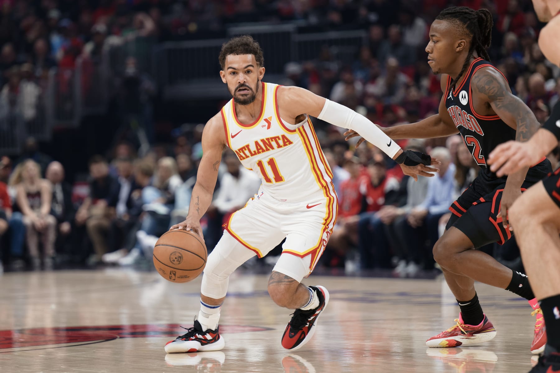CHICAGO, ILLINOIS - APRIL 17:  Trae Young #11 of the Atlanta Hawks controls the ball against the Chicago Bulls on April 17, 2024 at United Center in Chicago, Illinois.   NOTE TO USER: User expressly acknowledges and agrees that, by downloading and or using this photograph, User is consenting to the terms and conditions of the Getty Images License Agreement.  (Photo by Jamie Sabau/Getty Images)
