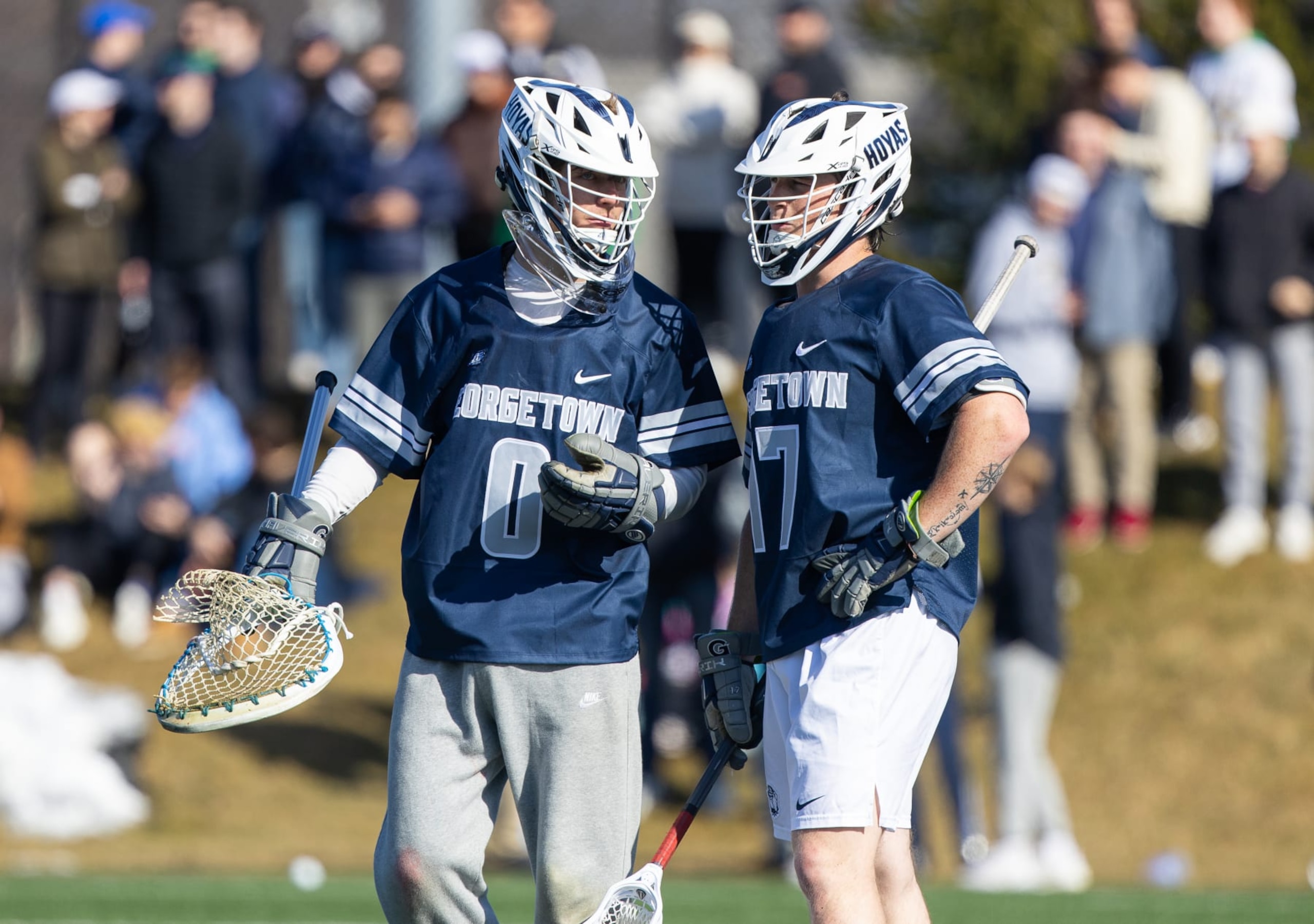 SOUTH BEND, IN - FEBRUARY 25: Anderson Moore #0 and Ty Banks #17 of Georgetown talk during a timeout during a game between Georgetown University and University of Notre Dame at Arlotta Stadium on February 25, 2024 in South Bend, Indiana. (Photo by Michael Miller/ISI Photos/Getty Images)