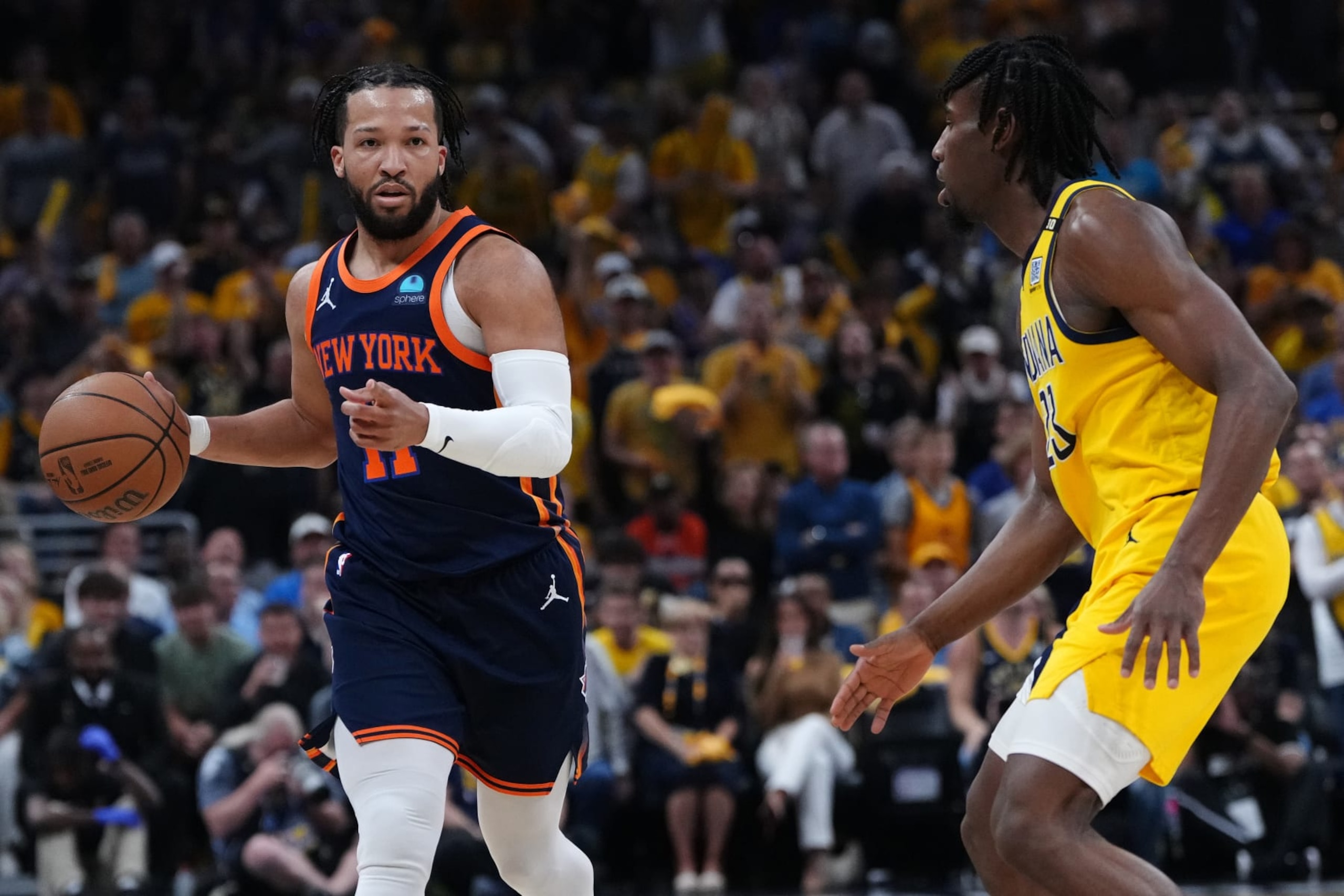 INDIANAPOLIS, INDIANA - MAY 12: Jalen Brunson #11 of the New York Knicks drives the ball up the court around Aaron Nesmith #23 of the Indiana Pacers in Game Four of the Eastern Conference Second Round Playoffs at Gainbridge Fieldhouse on May 12, 2024 in Indianapolis, Indiana. NOTE TO USER: User expressly acknowledges and agrees that, by downloading and or using this photograph, User is consenting to the terms and conditions of the Getty Images License Agreement. (Photo by Dylan Buell/Getty Images)
