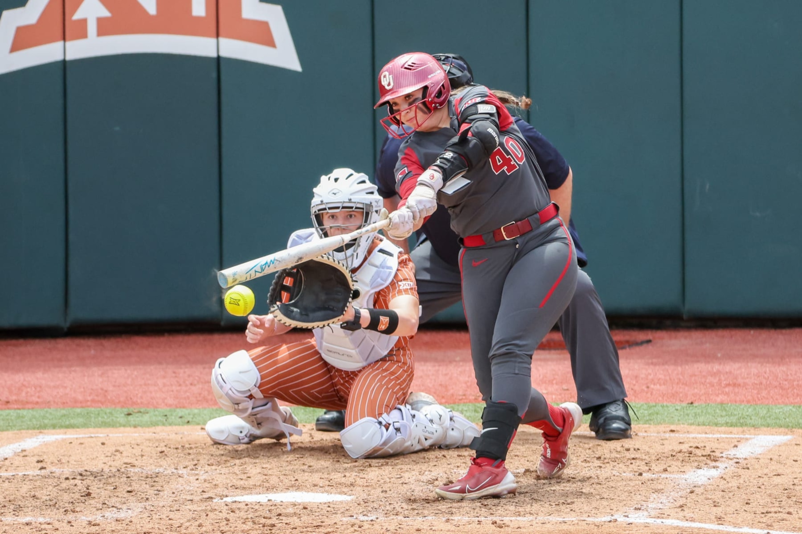 AUSTIN, TX - APRIL 07: Oklahoma utility Alynah Torres (40) hits a ground ball during the Big 12 college softball game between Texas Longhorns and Oklahoma Sooners on April 7, 2024, at Red & Charline McCombs Field in Austin, TX. (Photo by David Buono/Icon Sportswire via Getty Images) AUSTIN, TX - APRIL 07: Oklahoma utility Alynah Torres (40) hits a ground ball during the Big 12 college softball game between Texas Longhorns and Oklahoma Sooners on April 7, 2024, at Red & Charline McCombs Field in Austin, TX. (Photo by David Buono/Icon Sportswire via Getty Images)