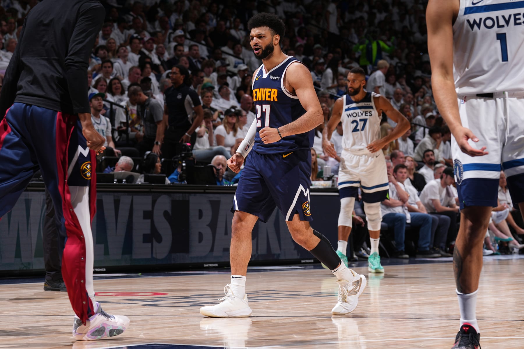 DENVER, CO - MAY 12: Jamal Murray #27 of the Denver Nuggets celebrates during the game against the Minnesota Timberwolves during Round 2 Game 4 of the 2024 NBA Playoffs on May 12, 2024 at the Ball Arena in Denver, Colorado. NOTE TO USER: User expressly acknowledges and agrees that, by downloading and/or using this Photograph, user is consenting to the terms and conditions of the Getty Images License Agreement. Mandatory Copyright Notice: Copyright 2024 NBAE (Photo by Garrett Ellwood/NBAE via Getty Images)
