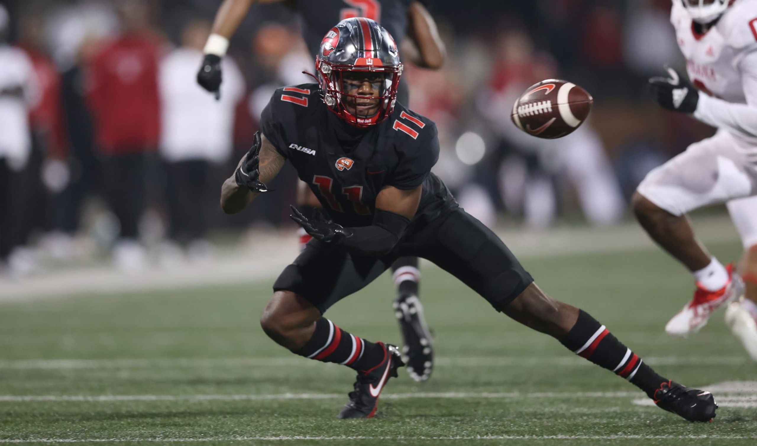 BOWLING GREEN, KENTUCKY - SEPTEMBER 25: Malachi Corley #11 of the Western Kentucky Hilltoppers catches a pass against the Indiana Hoosiers at Houchens Industries-L.T. Smith Stadium on September 25, 2021 in Bowling Green, Kentucky. (Photo by Andy Lyons/Getty Images)