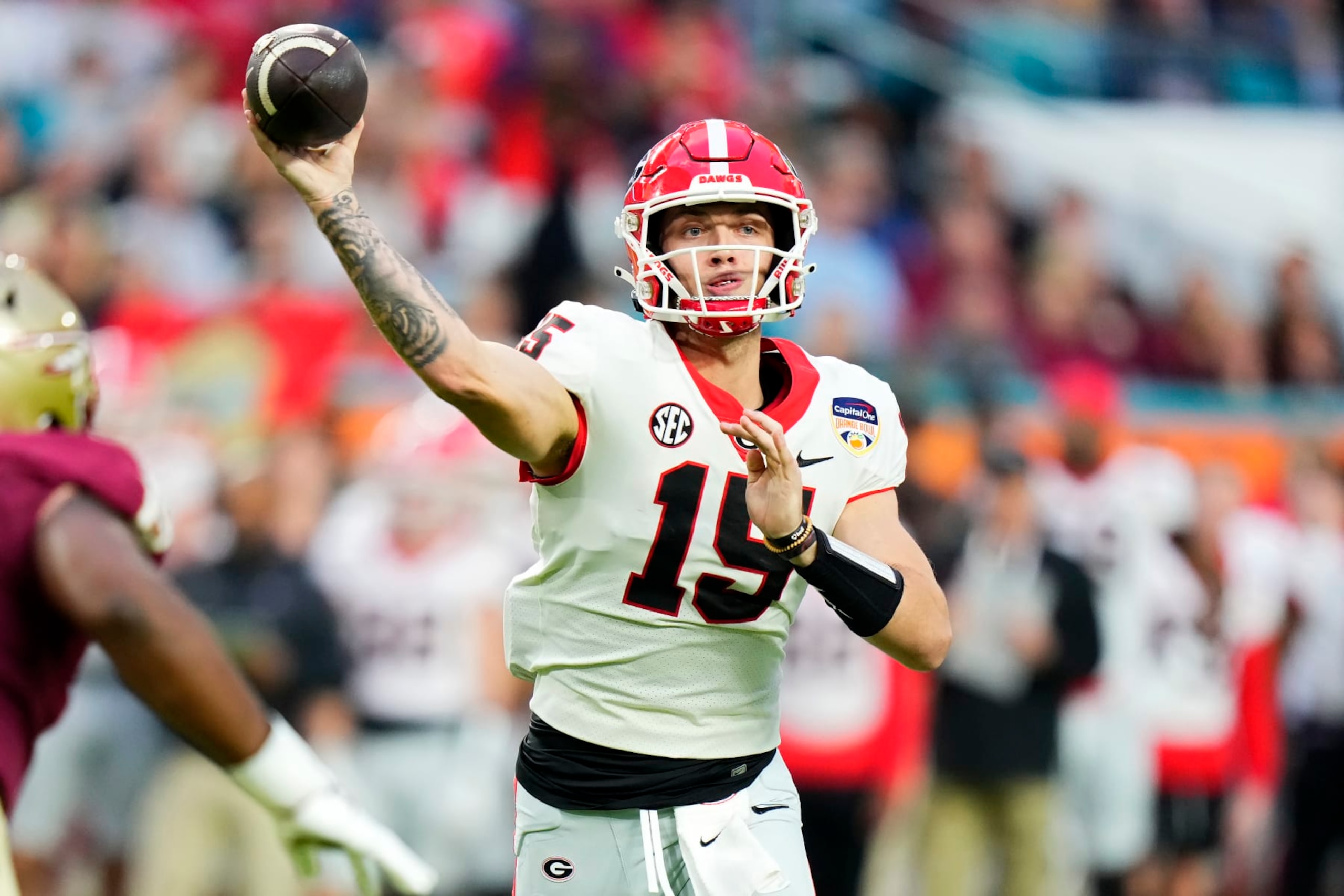 MIAMI GARDENS, FLORIDA - DECEMBER 30: Carson Beck #15 of the Georgia Bulldogs throws a pass in the second quarter against the Florida State Seminoles during the Capital One Orange Bowl at Hard Rock Stadium on December 30, 2023 in Miami Gardens, Florida. (Photo by Rich Storry/Getty Images) MIAMI GARDENS, FLORIDA - DECEMBER 30: Carson Beck #15 of the Georgia Bulldogs throws a pass in the second quarter against the Florida State Seminoles during the Capital One Orange Bowl at Hard Rock Stadium on December 30, 2023 in Miami Gardens, Florida. (Photo by Rich Storry/Getty Images)