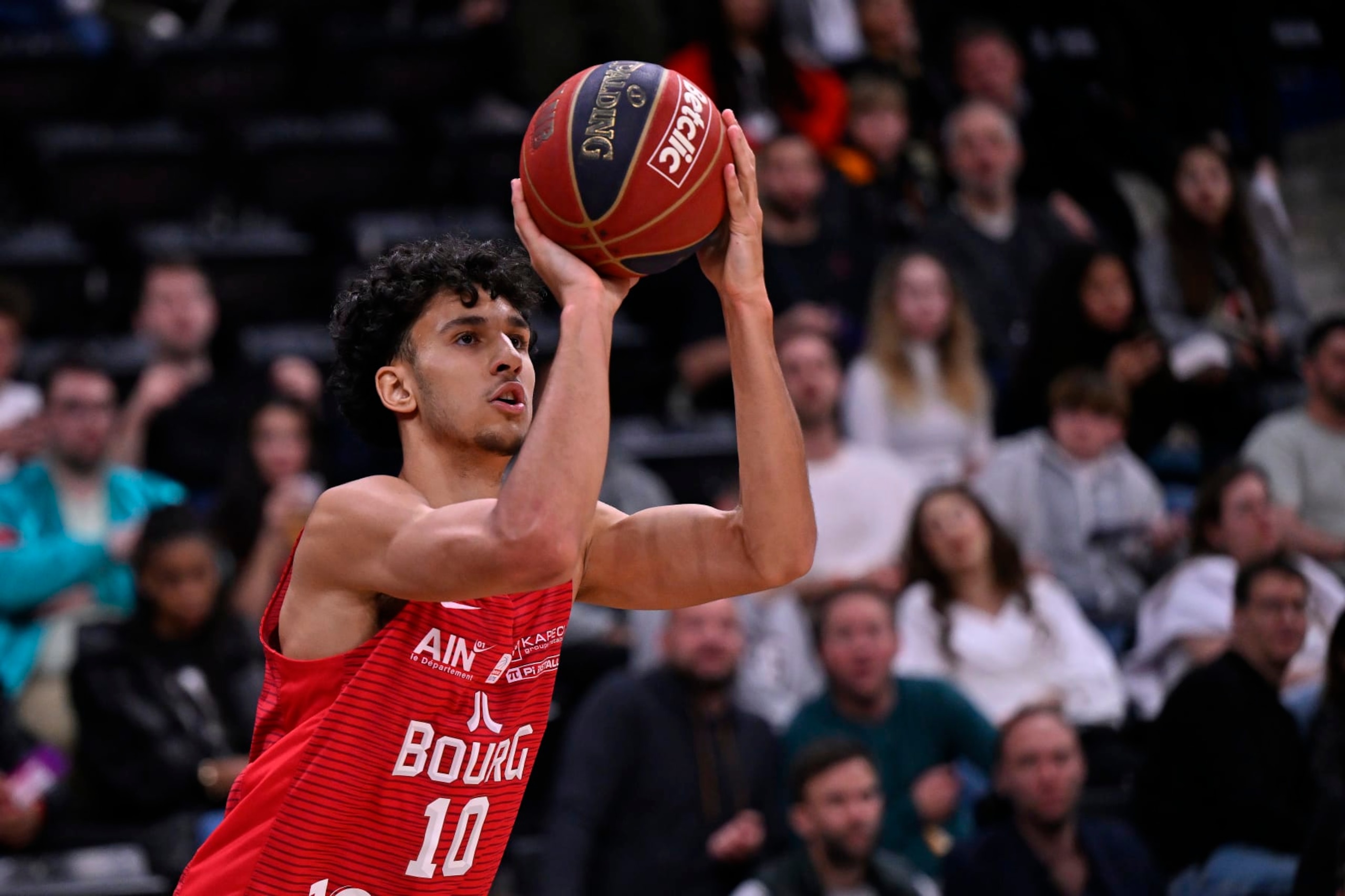 PARIS, FRANCE - APRIL 28: Zaccharie Risacher of Bourg en Bresse Basket takes a jump shoot during the Betclic Elite match between Paris and Bourg en Bresse Basket at Adidas Arena on April 28, 2024 in Paris, France. (Photo by Aurelien Meunier/Getty Images)