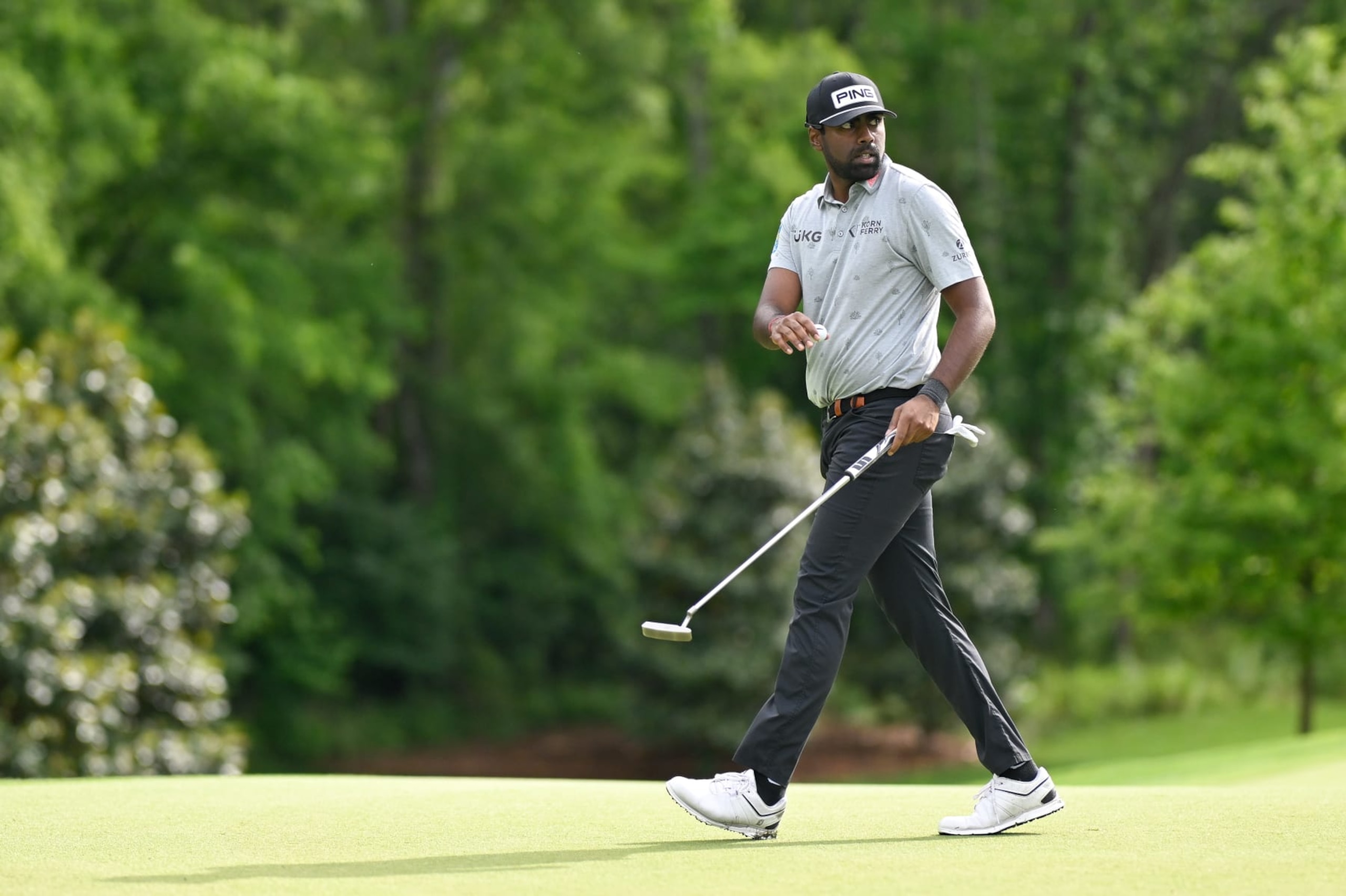 CHARLOTTE, NORTH CAROLINA - MAY 09: Sahith Theegala waves his ball on the 12th green during the first round of Wells Fargo Championship at Quail Hollow Club on May 9, 2024 in Charlotte, North Carolina. (Photo by Ben Jared/PGA TOUR via Getty Images)