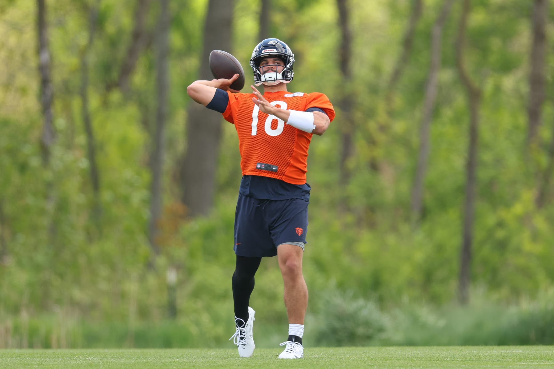 LAKE FOREST, ILLINOIS - MAY 11: Caleb Williams #18 of the Chicago Bears throws a pass during Chicago Bears Rookie Minicamp at Halas Hall on May 11, 2024 in Lake Forest, Illinois.  (Photo by Michael Reaves/Getty Images)