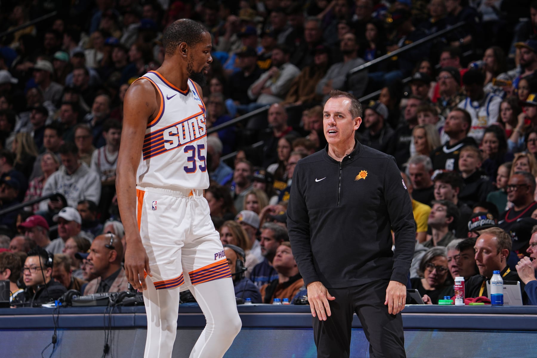 DENVER, CO - MARCH 27: Kevin Durant #35 and Head Coach Frank Vogel of the Phoenix Suns talk during the game against the Denver Nuggets on March 27, 2024 at the Ball Arena in Denver, Colorado. NOTE TO USER: User expressly acknowledges and agrees that, by downloading and/or using this Photograph, user is consenting to the terms and conditions of the Getty Images License Agreement. Mandatory Copyright Notice: Copyright 2024 NBAE (Photo by Bart Young/NBAE via Getty Images)