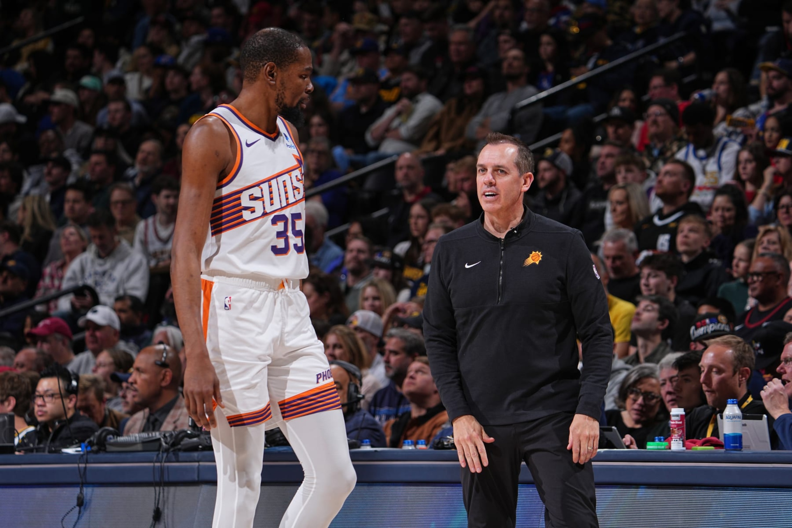 DENVER, CO - MARCH 27: Kevin Durant #35 and Head Coach Frank Vogel of the Phoenix Suns talk during the game against the Denver Nuggets on March 27, 2024 at the Ball Arena in Denver, Colorado. NOTE TO USER: User expressly acknowledges and agrees that, by downloading and/or using this Photograph, user is consenting to the terms and conditions of the Getty Images License Agreement. Mandatory Copyright Notice: Copyright 2024 NBAE (Photo by Bart Young/NBAE via Getty Images) DENVER, CO - MARCH 27: Kevin Durant #35 and Head Coach Frank Vogel of the Phoenix Suns talk during the game against the Denver Nuggets on March 27, 2024 at the Ball Arena in Denver, Colorado. NOTE TO USER: User expressly acknowledges and agrees that, by downloading and/or using this Photograph, user is consenting to the terms and conditions of the Getty Images License Agreement. Mandatory Copyright Notice: Copyright 2024 NBAE (Photo by Bart Young/NBAE via Getty Images)