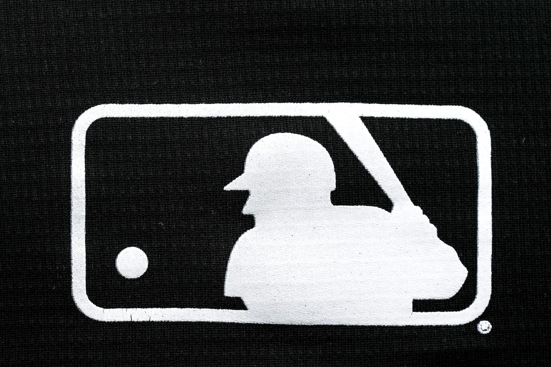 DETROIT, MICHIGAN - APRIL 28: A detail of the MLB Major League Baseball logo on an article of clothing during the game between the Detroit Tigers and Kansas City Royals at Comerica Park on April 28, 2024 in Detroit, Michigan. (Photo by Nic Antaya/Getty Images)