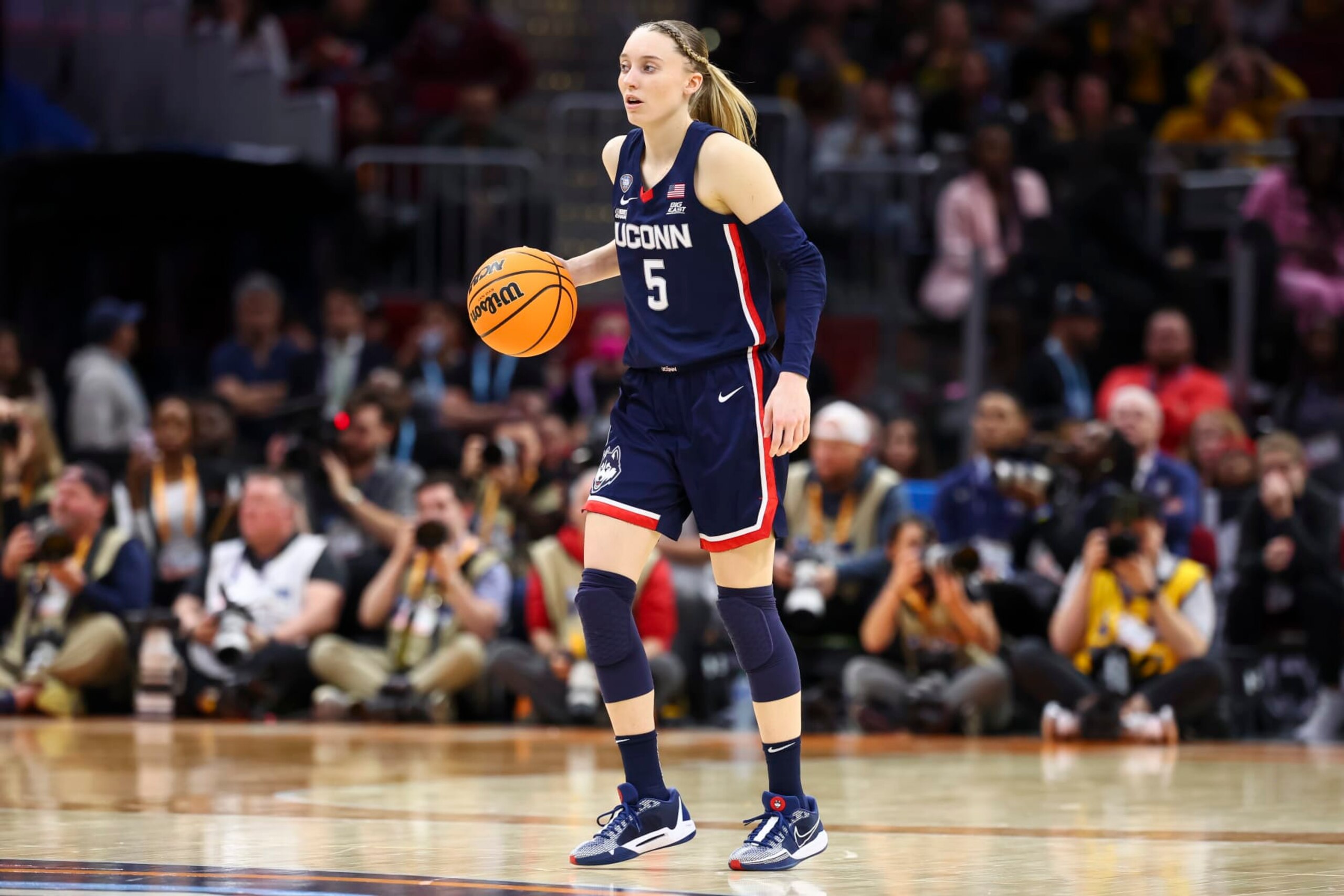 CLEVELAND, OHIO - APRIL 5: Paige Bueckers #5 of the UConn Huskies dribbles against the Iowa Hawkeyes during the NCAA Women's Basketball Tournament Final Four semifinal game at Rocket Mortgage Fieldhouse on April 5, 2024 in Cleveland, Ohio. (Photo by C. Morgan Engel/NCAA Photos via Getty Images)