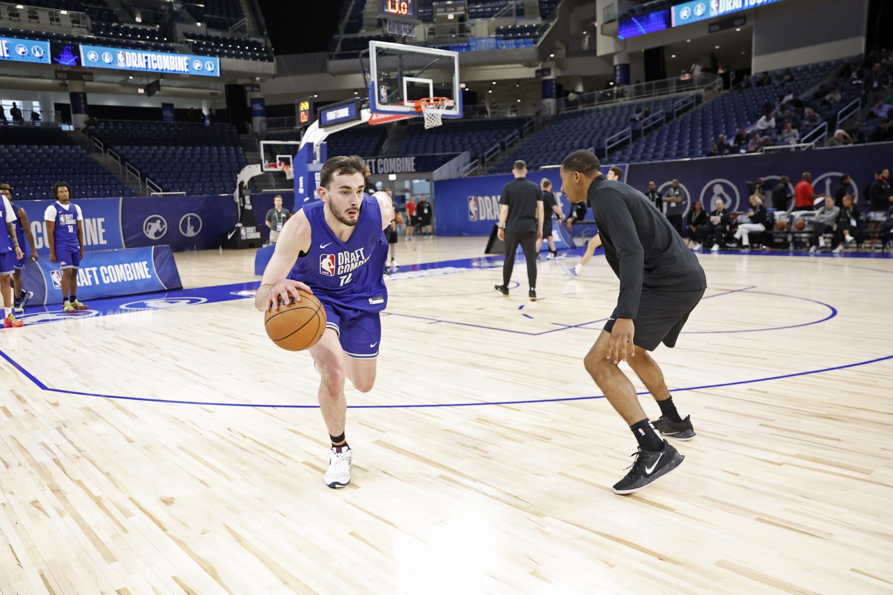 CHICAGO, IL - MAY 13: Alex Karaban dribbles the ball during the 2024 NBA Combine on May 13, 2024 at Wintrust Arena in Chicago, Illinois. NOTE TO USER: User expressly acknowledges and agrees that, by downloading and or using this photograph, User is consenting to the terms and conditions of the Getty Images License Agreement. Mandatory Copyright Notice: Copyright 2024 NBAE (Photo by Kamil Krzaczynski/NBAE via Getty Images)