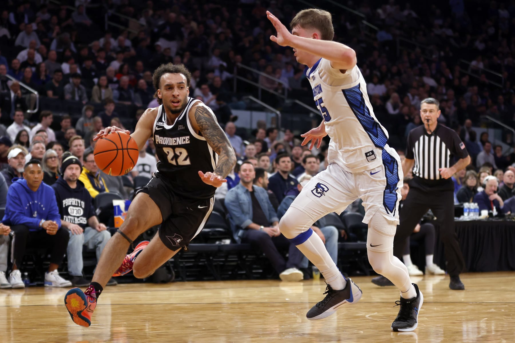 NEW YORK, NEW YORK - MARCH 14: Devin Carter #22 of the Providence Friars dribbles against Baylor Scheierman #55 of the Creighton Bluejays in the first half during the Quarterfinals of the Big East Basketball Tournament at Madison Square Garden on March 14, 2024 in New York City. (Photo by Sarah Stier/Getty Images)