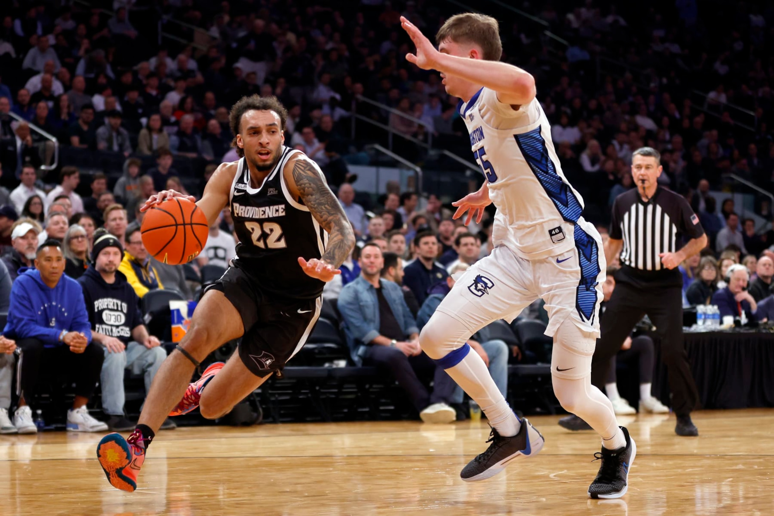 NEW YORK, NEW YORK - MARCH 14: Devin Carter #22 of the Providence Friars dribbles against Baylor Scheierman #55 of the Creighton Bluejays in the first half during the Quarterfinals of the Big East Basketball Tournament at Madison Square Garden on March 14, 2024 in New York City. (Photo by Sarah Stier/Getty Images)