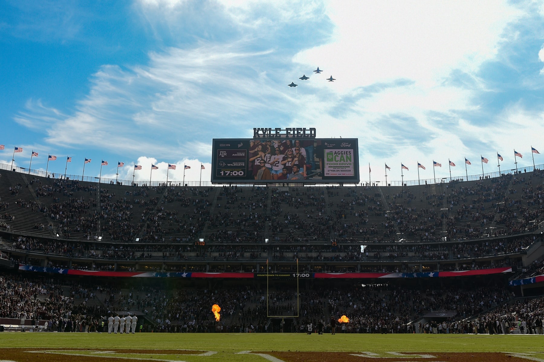 COLLEGE STATION, TX - NOVEMBER 18: A flight of FA-18s and F-35s perform a flyover at the end of the National Anthem before the football game between the Abilene Christian Wildcats and Texas A&M Aggies at Kyle Field on November 18, 2023  in College Station, Texas. (Photo by Ken Murray/Icon Sportswire via Getty Images)