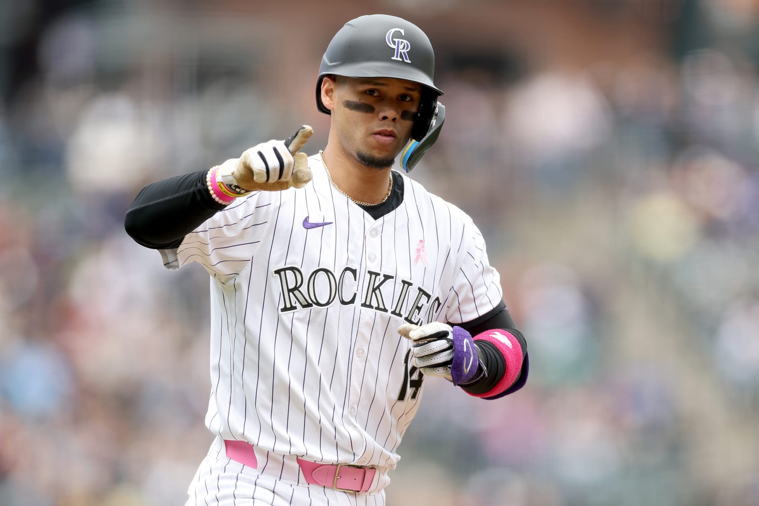DENVER, COLORADO - MAY 12: Ezequiel Tovar #14 of the Colorado Rockies gestures as he circles the bases after hitting a 2 RBI home run against the Texas Rangers in the first inning at Coors Field on May 12, 2024 in Denver, Colorado. (Photo by Matthew Stockman/Getty Images) DENVER, COLORADO - MAY 12: Ezequiel Tovar #14 of the Colorado Rockies gestures as he circles the bases after hitting a 2 RBI home run against the Texas Rangers in the first inning at Coors Field on May 12, 2024 in Denver, Colorado. (Photo by Matthew Stockman/Getty Images)