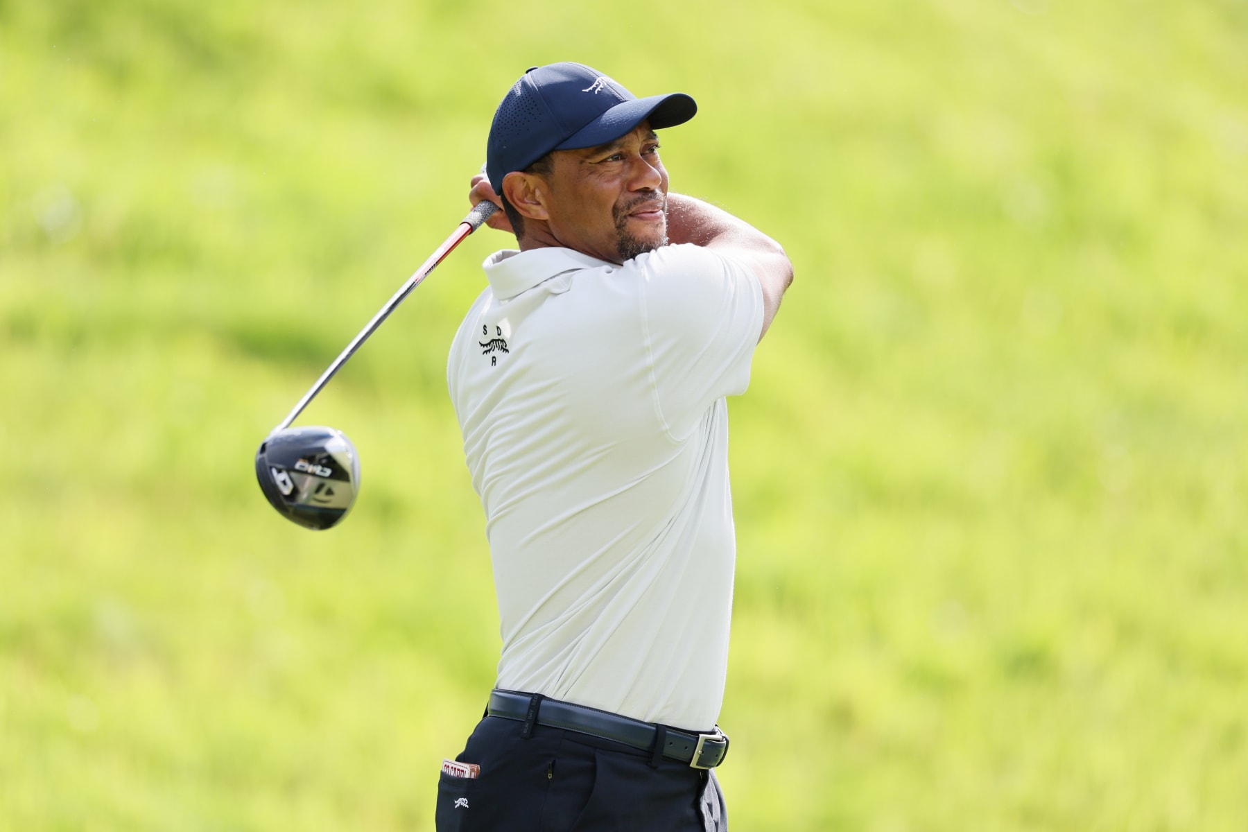 LOUISVILLE, KENTUCKY - MAY 13: Tiger Woods of the United States plays his shot during a practice round prior to the 2024 PGA Championship at Valhalla Golf Club on May 13, 2024 in Louisville, Kentucky. (Photo by Andy Lyons/Getty Images)