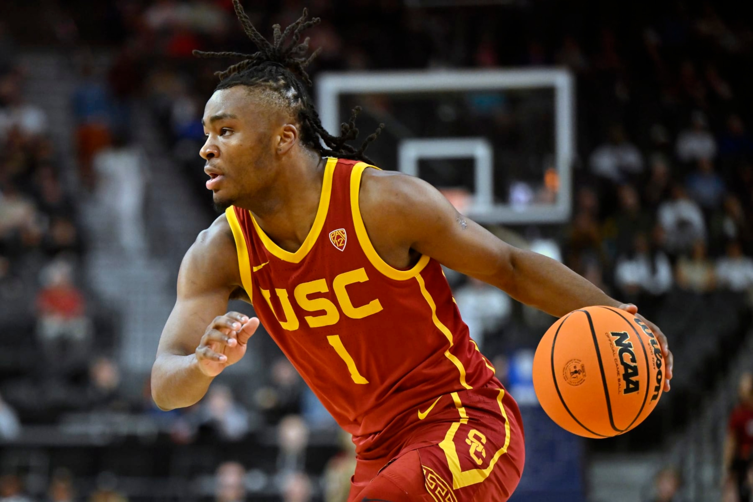 LAS VEGAS, NEVADA - MARCH 13: Isaiah Collier #1 of the USC Trojans handles the ball against the Washington Huskies in the first half of a first round game in the Pac-12 Conference basketball tournament at T-Mobile Arena on March 13, 2024 in Las Vegas, Nevada. (Photo by David Becker/Getty Images)