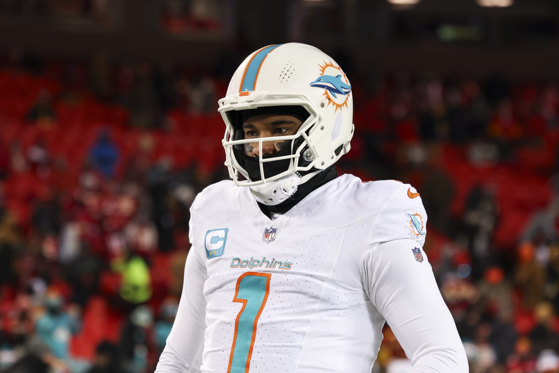 KANSAS CITY, MISSOURI - JANUARY 13: Tua Tagovailoa #1 of the Miami Dolphins warms up prior to an NFL wild-card playoff football game against the Kansas City Chiefs at GEHA Field at Arrowhead Stadium on January 13, 2024 in Kansas City, Missouri. (Photo by Kara Durrette/Getty Images)