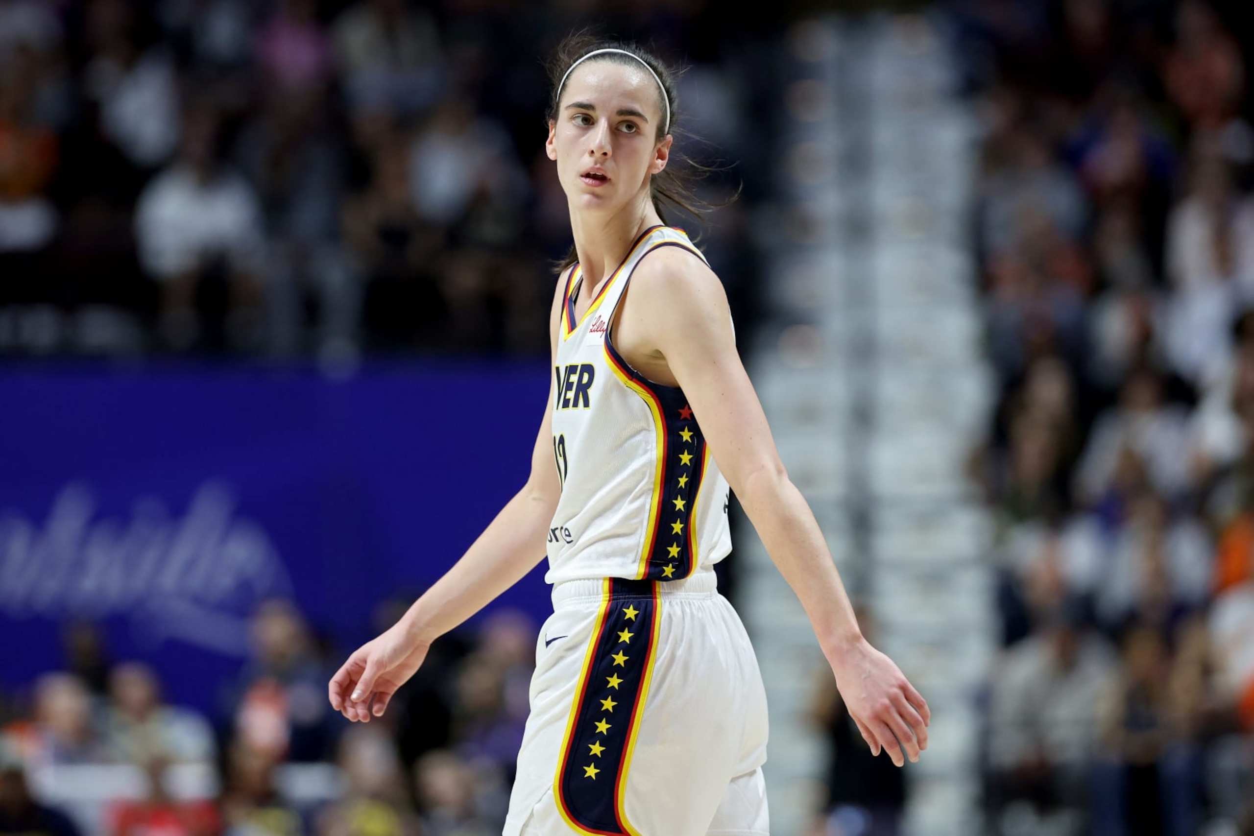 UNCASVILLE, CONNECTICUT - MAY 14: Caitlin Clark #22 of the Indiana Fever looks on during the first quarter against the Connecticut Sun in the game at Mohegan Sun Arena on May 14, 2024 in Uncasville, Connecticut. NOTE TO USER: User expressly acknowledges and agrees that, by downloading and or using this photograph, User is consenting to the terms and conditions of the Getty Images License Agreement. (Photo by Elsa/Getty Images)