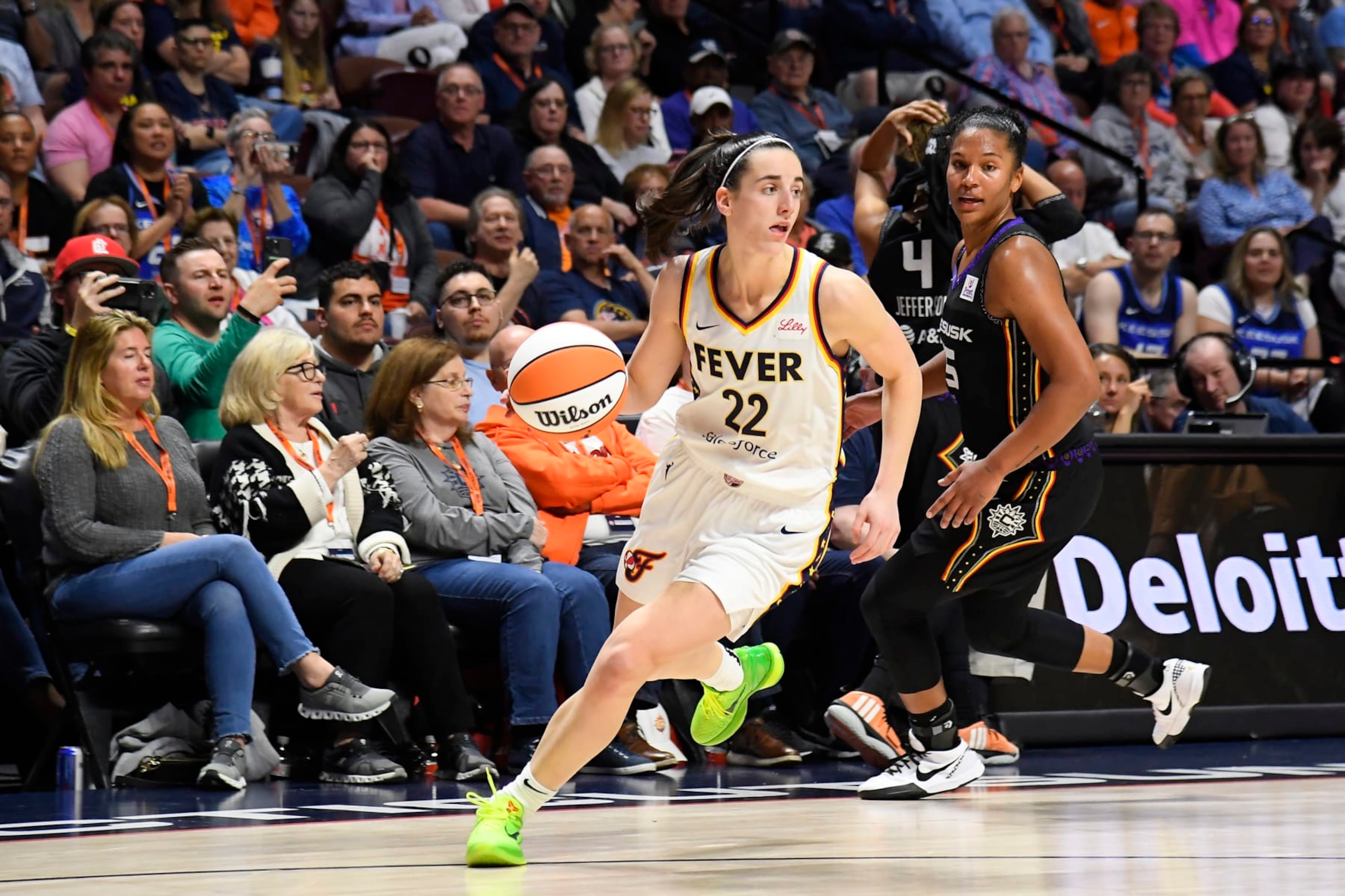 UNCASVILLE, CT - MAY 14: Caitlin Clark #22 of the Indiana Fever handles the ball during the game against the Connecticut Sun on May 14, 2024 at the Mohegan Sun Arena in Uncasville, Connecticut. NOTE TO USER: User expressly acknowledges and agrees that, by downloading and or using this photograph, User is consenting to the terms and conditions of the Getty Images License Agreement. Mandatory Copyright Notice: Copyright 2024 NBAE (Photo by Brian Babineau/NBAE via Getty Images) UNCASVILLE, CT - MAY 14: Caitlin Clark #22 of the Indiana Fever handles the ball during the game against the Connecticut Sun on May 14, 2024 at the Mohegan Sun Arena in Uncasville, Connecticut. NOTE TO USER: User expressly acknowledges and agrees that, by downloading and or using this photograph, User is consenting to the terms and conditions of the Getty Images License Agreement. Mandatory Copyright Notice: Copyright 2024 NBAE (Photo by Brian Babineau/NBAE via Getty Images)