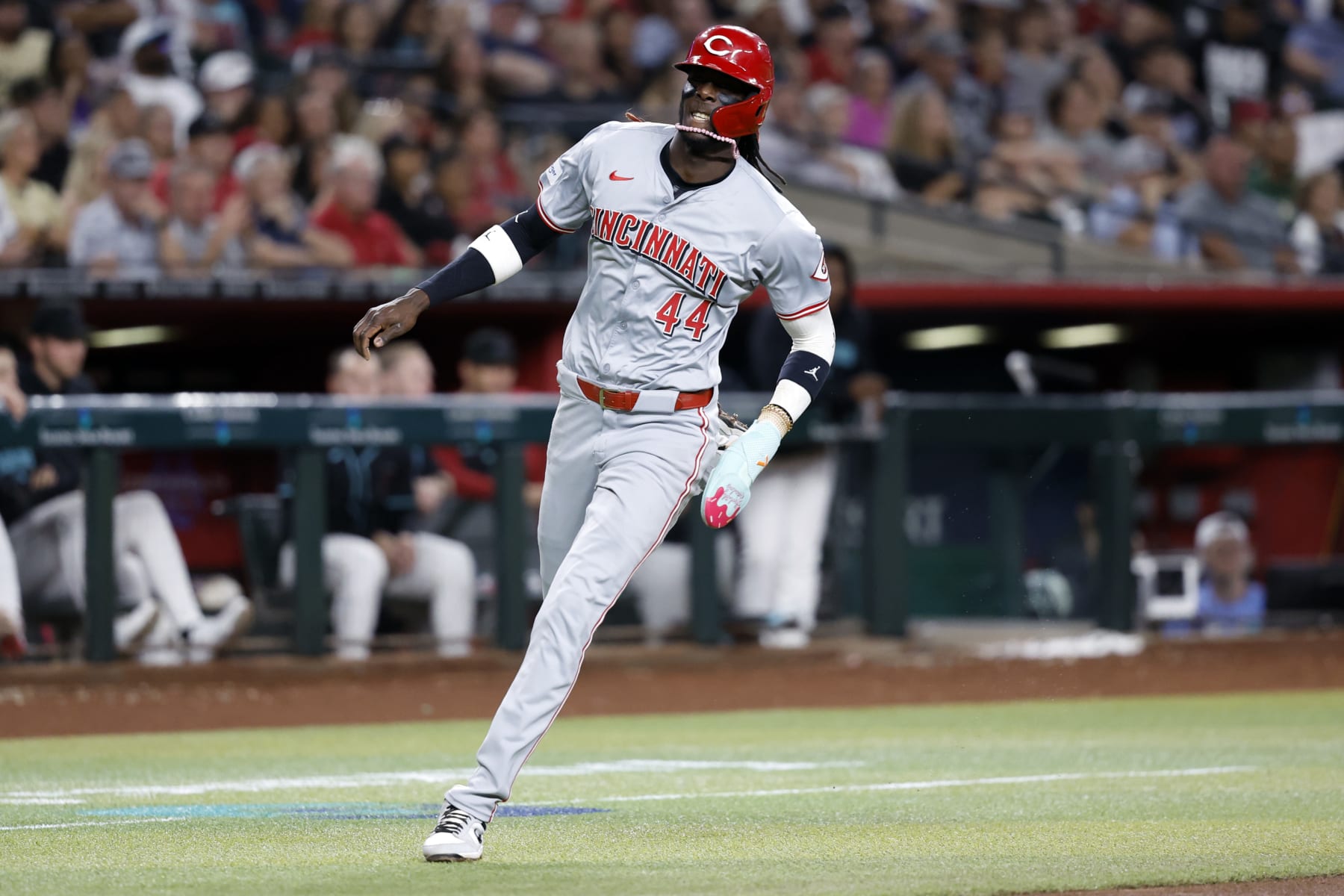 PHOENIX, ARIZONA - MAY 13: Elly De La Cruz #44 of the Cincinnati Reds scores a run on a hit by Spencer Steer during the third inning against the Arizona Diamondbacks at Chase Field on May 13, 2024 in Phoenix, Arizona. (Photo by Chris Coduto/Getty Images)