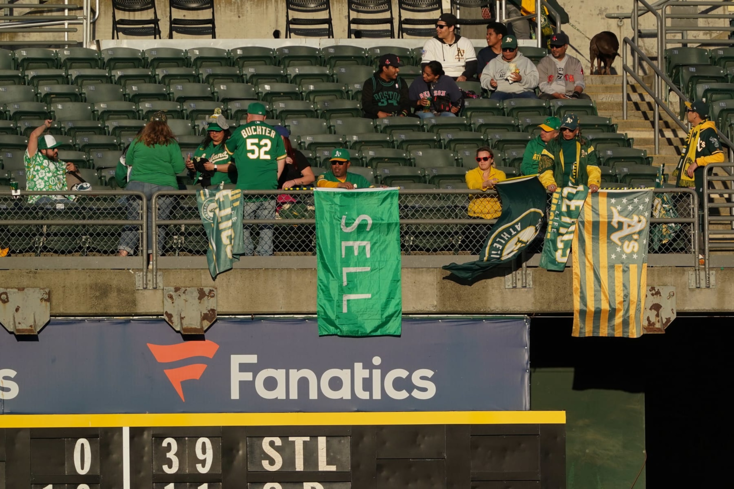 OAKLAND, CALIFORNIA - APRIL 02: A fan sits behind a "SELL" flag as the Boston Red Sox play the Oakland Athletics at Oakland Coliseum on April 02, 2024 in Oakland, California. (Photo by Loren Elliott/Getty Images) OAKLAND, CALIFORNIA - APRIL 02: A fan sits behind a "SELL" flag as the Boston Red Sox play the Oakland Athletics at Oakland Coliseum on April 02, 2024 in Oakland, California. (Photo by Loren Elliott/Getty Images)