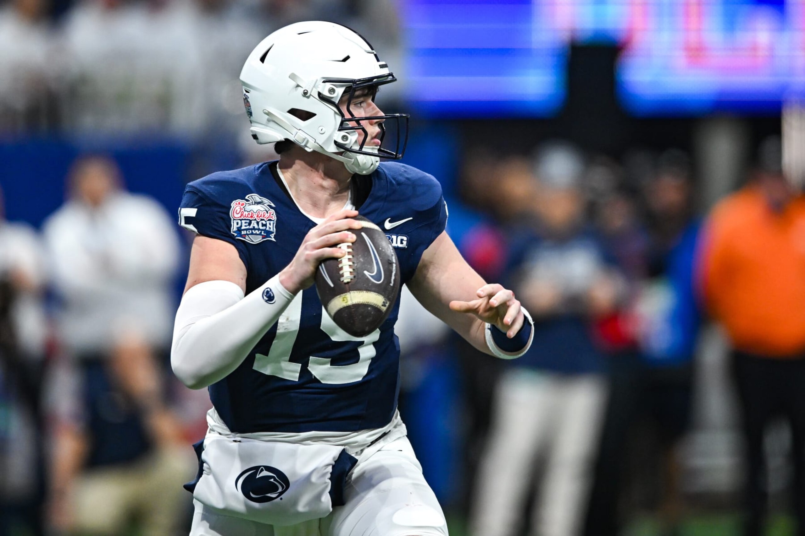 ATLANTA, GA  DECEMBER 30:  Penn State quarterback Drew Allar (15) drops back to pass during the Chick-fil-A Peach Bowl game between the Ole Miss Rebels and the Penn State Nittany Lions on December 30th, 2023 at Mercedes-Benz Stadium in Atlanta, GA.  (Photo by Rich von Biberstein/Icon Sportswire via Getty Images)