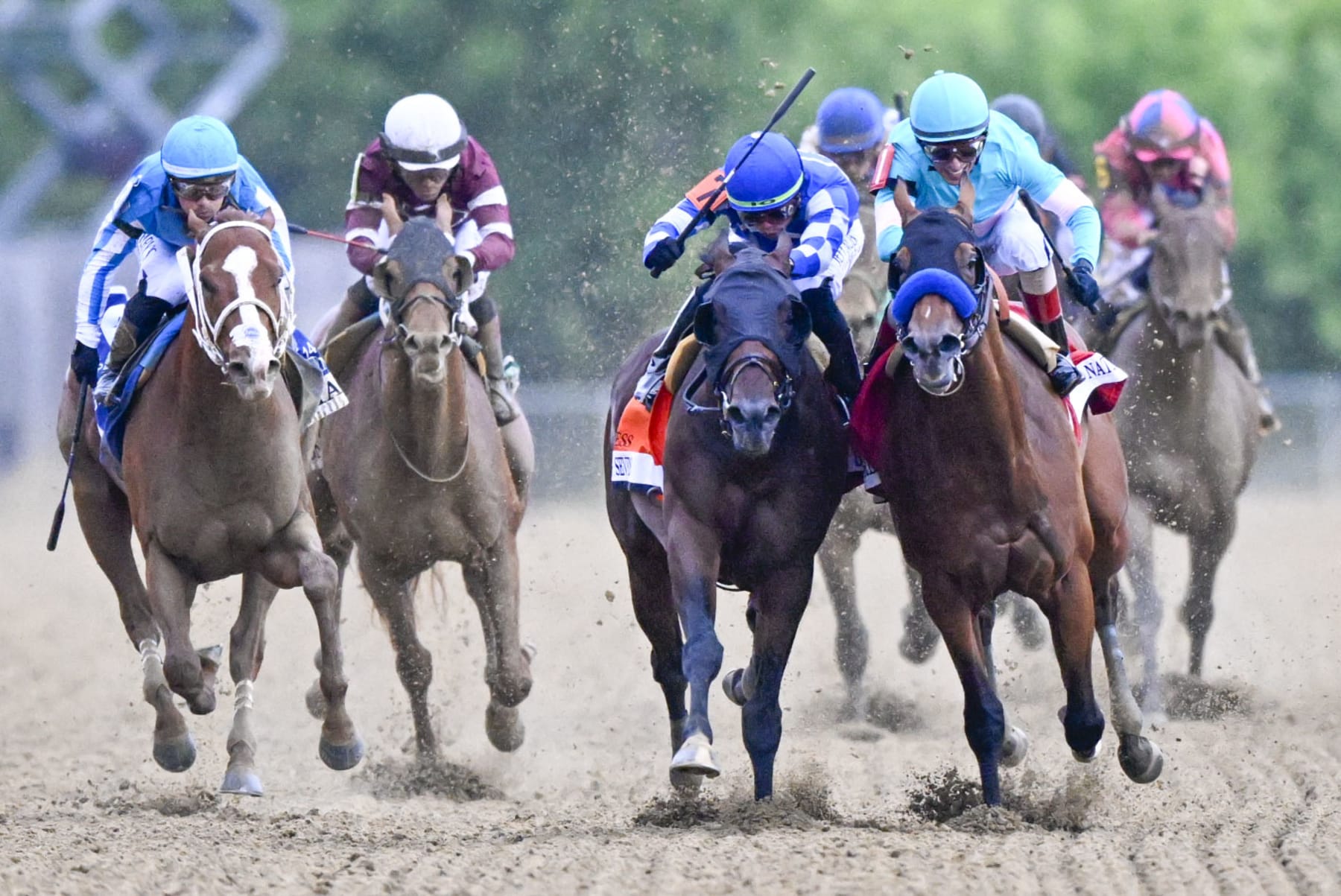BALTIMORE, MD - MAY 20: National Treasure (1) with jockey John Velazquez on board bumps against Blazing Sevens (7) with Brad Ortiz, jr down the stretch and wins the 148th running of the Preakness Stakes at Pimlico Race Course on May 20, 2023.  (Photo by Jonathan Newton/The Washington Post via Getty Images)